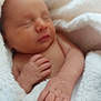 Evelynn is registered to the contest to win money with this photo: newborn, baby, sleeping, blanket, hand, skin, soft_texture, close_up, infant, peaceful, rest, cozy, warm, child, portrait, human, wrapped, cute, tender, sleep