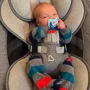 Jordan is registered to the contest to win money with this photo: baby, bed, car, clothing, cushion, face, furniture, glove, hat, head, homedecor, newborn, pants, person, photography, portrait, sleeping, toy, transportation, vehicle