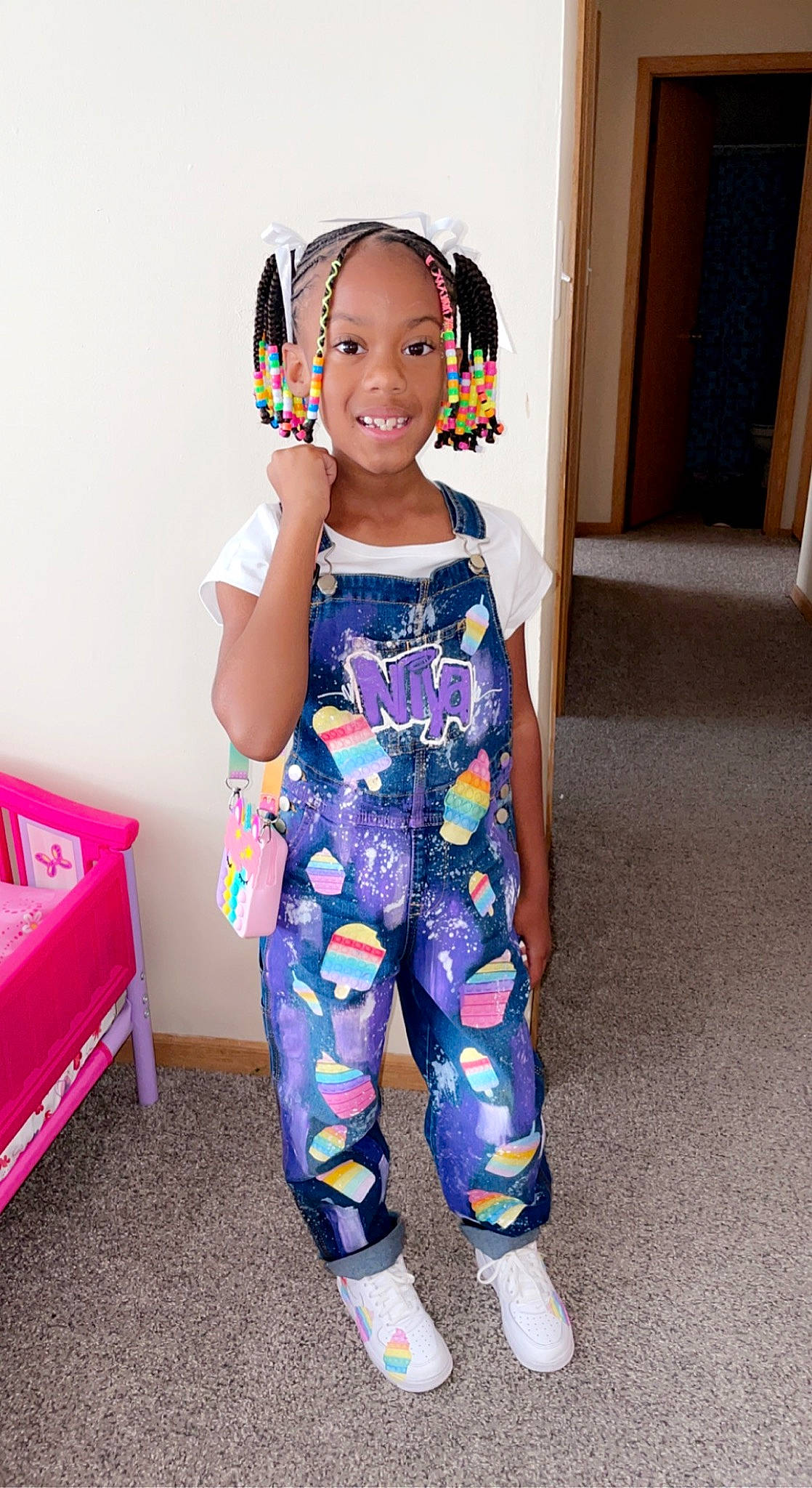 Oniya is registered to the contest to win money with this photo: baby_toddler_clothing, clothing, electric_blue, face, hairstyle, happy, head, joy, knee, leg, magenta, pattern, person, pink, shoulder, sleeve, smile, sweatpant, t_shirt, thigh