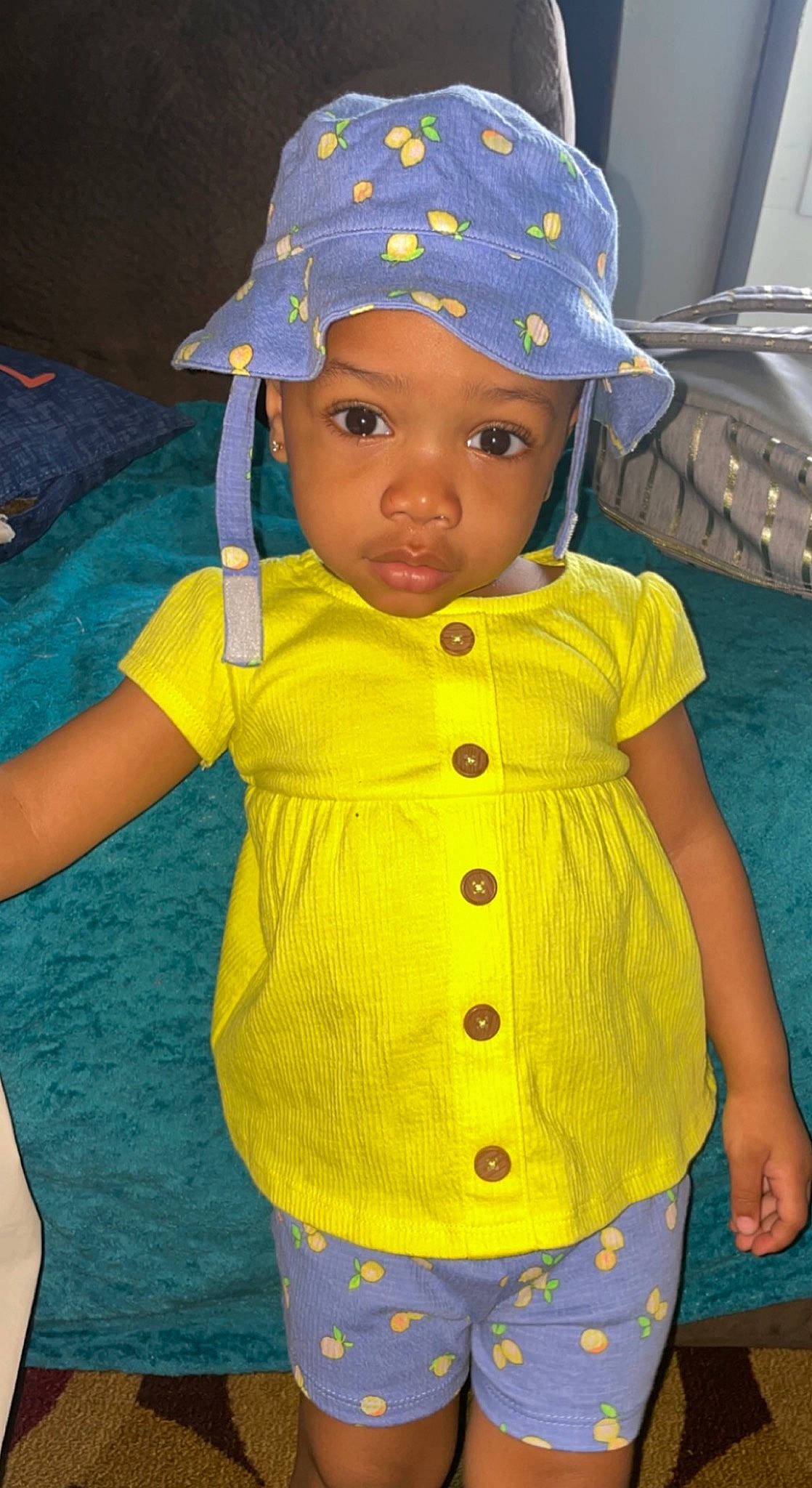Jaiana is registered to the contest to win money with this photo: arm, azure, baby, baby_toddler_clothing, blue, cap, child, electric_blue, eye, hand, happy, headwear, outerwear, person, pink, product, sleeve, t_shirt, textile, toddler