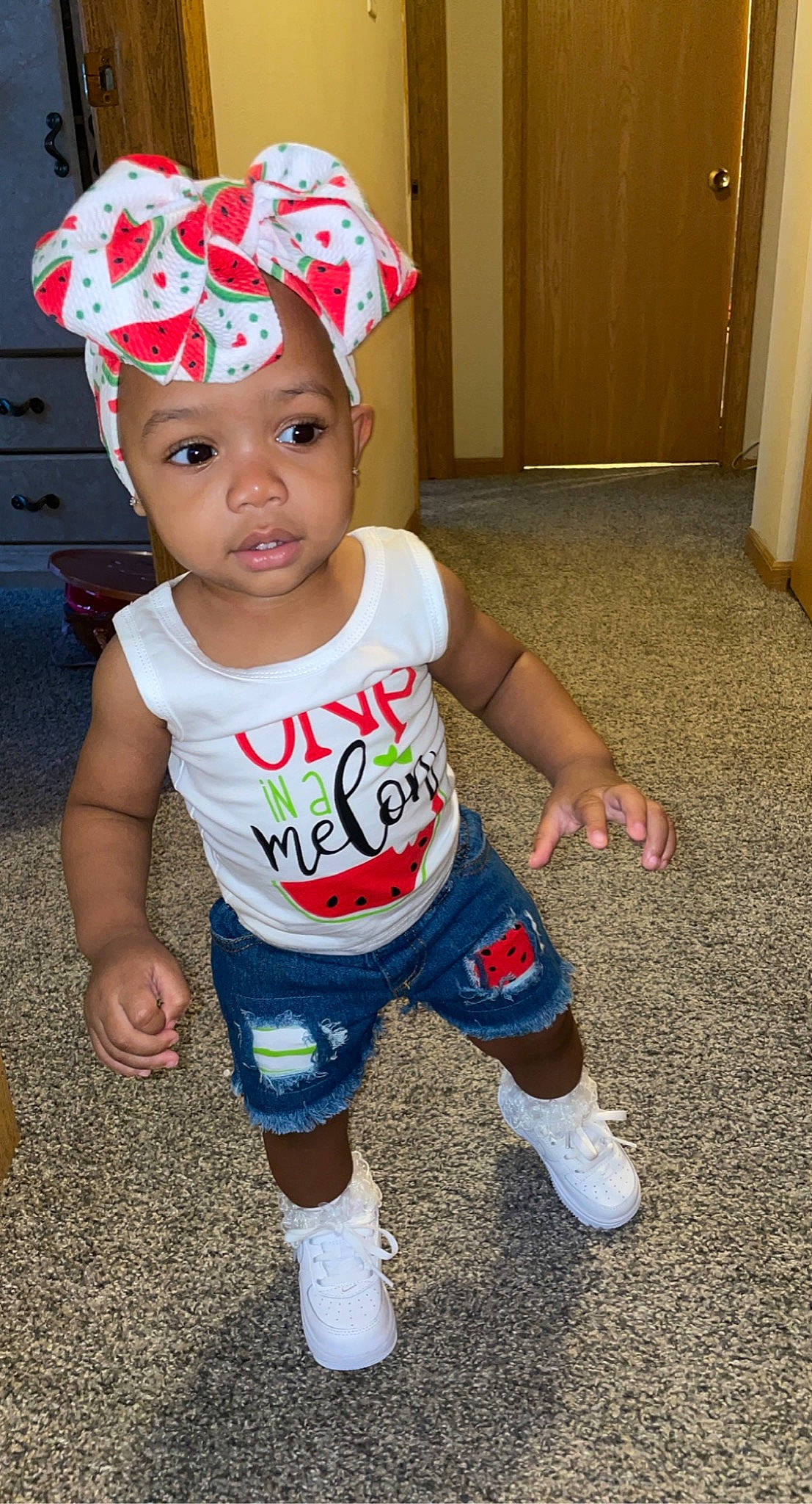 Jaiana is registered to the contest to win money with this photo: baby, baby_toddler_clothing, baseball_cap, cabinetry, cap, child, costume, costume_hat, door, facial_expression, flooring, fun, happy, headwear, holiday, party_supply, person, shorts, sleeve, sock