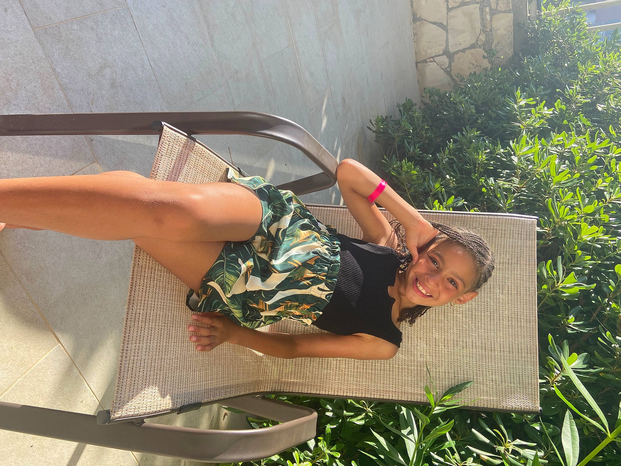 Aliyah participe au concours pour gagner de l'argent avec cette photo : barefoot, calf, comfort, dress, elbow, eyewear, foot, fun, grass, human_leg, joy, knee, leg, leisure, outdoor_furniture, people_in_nature, person, plant, shrub, sitting