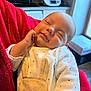 Alessio participe au concours pour gagner de l'argent avec cette photo : baby, sleeping, blanket, red_blanket, bunny_outfit, infant, cute, cozy, hand_near_face, indoors, kitchen, appliance, window, soft_lighting, portrait, child, peaceful, smiling, clothing, newborn