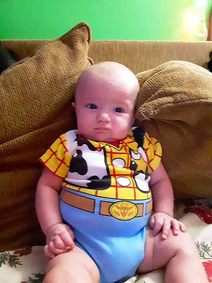 Weylin is registered to the contest to win money with this photo: baby, baby_toddler_clothing, chair, cheek, comfort, eye, head, human_body, human_leg, knee, lap, leg, mouth, person, skin, sleeve, textile, thigh, toddler, toy