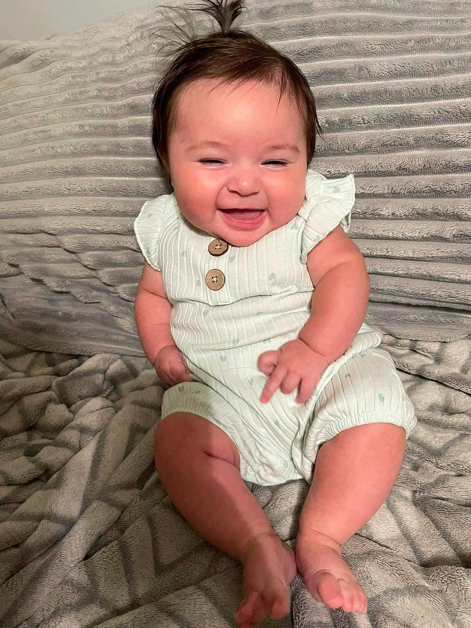 Letty is registered to the contest to win money with this photo: baby, baby_toddler_clothing, cheek, chin, eye, face, facial_expression, finger, flash_photography, fun, grass, hairstyle, happy, iris, mammal, person, skin, sleeve, smile, standing