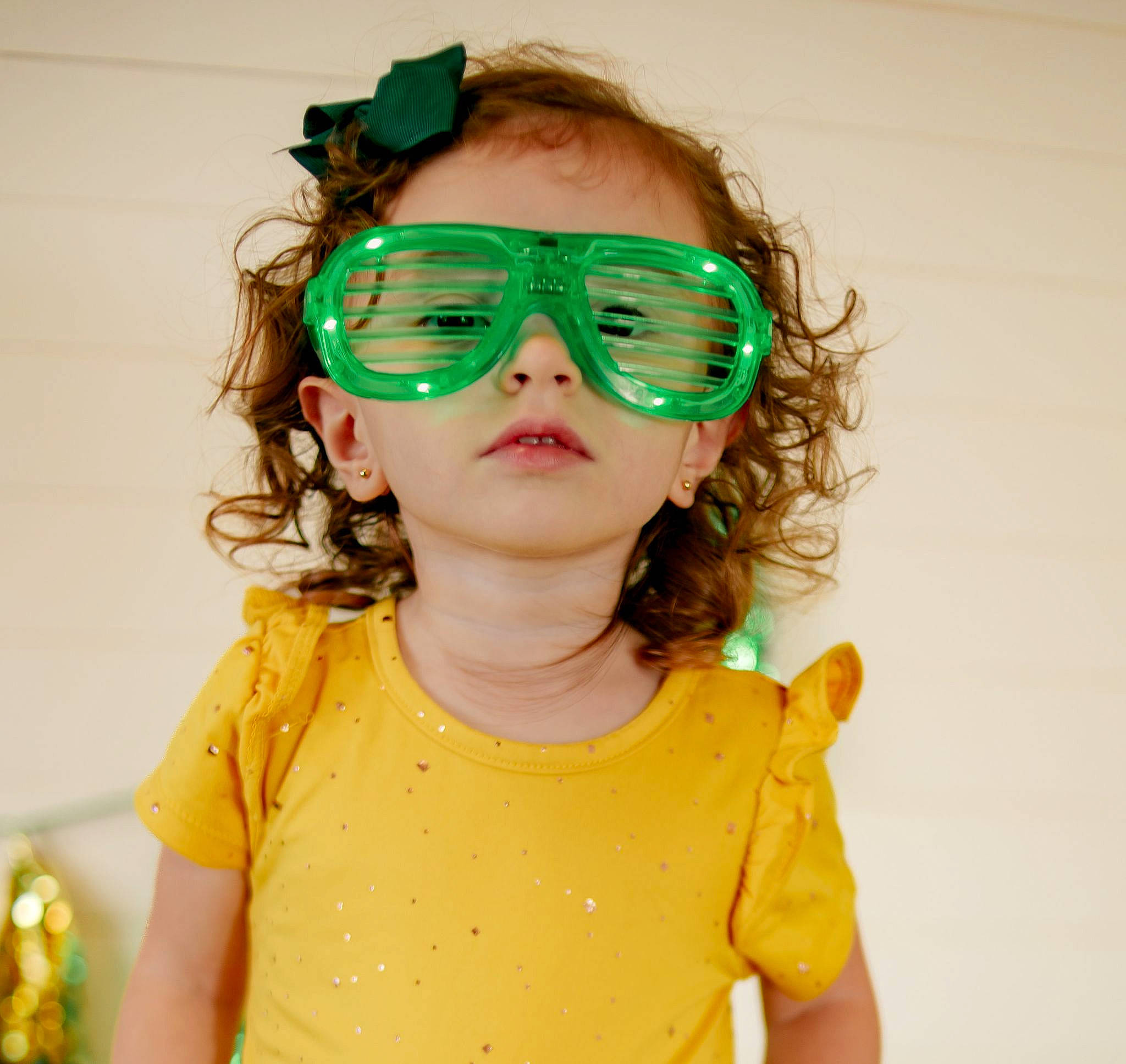 Kalani is registered to the contest to win money with this photo: baby_toddler_clothing, cheek, chin, cool, eye_glass_accessory, eyelash, eyewear, goggles, hair, happy, head, lip, neck, person, personal_protective_equipment, skin, sleeve, sunglasses, t_shirt, toddler
