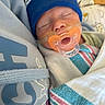 Phoenix is registered to the contest to win money with this photo: newborn, baby, sleeping, pacifier, blue_hat, hospital_blanket, wrapped, infant, closeup, face, taped_pacifier, soft_fabric, cozy, resting, child, cute, indoors, person, peaceful, blanket