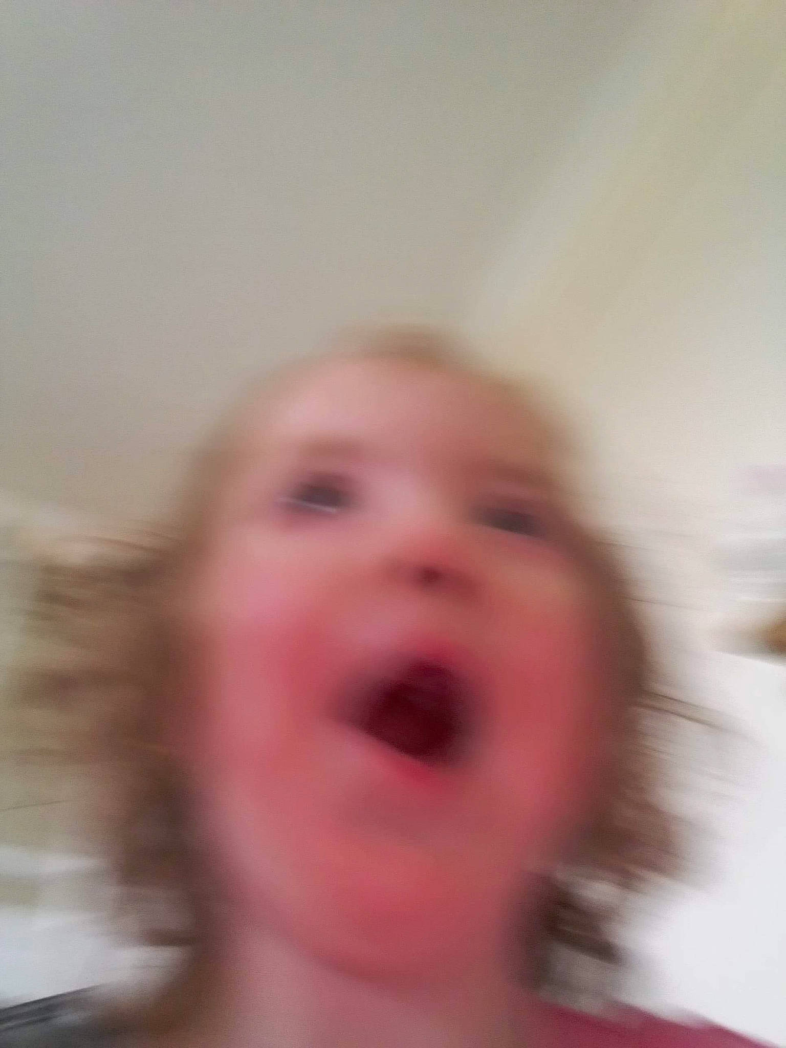 Orla is registered to the contest to win money with this photo: blurred, cheek, ear, eye, eyelash, facial_hair, fun, gesture, happy, human_body, iris, jaw, neck, nose, person, shout, smile, throat, thumb, toddler