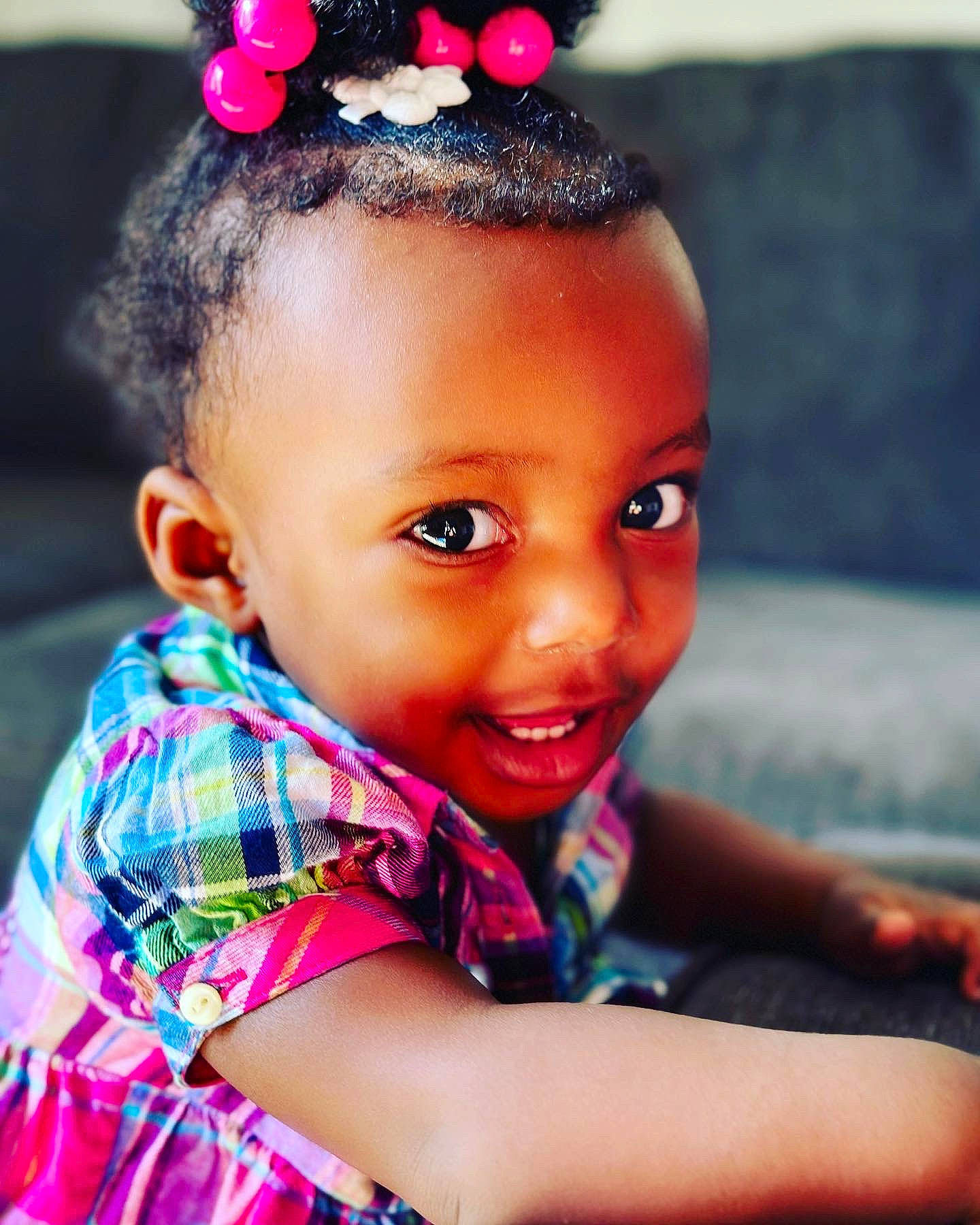 Sereniti is registered to the contest to win money with this photo: black_hair, cheek, chin, clothing, eye, eyelash, face, facial_expression, flash_photography, forehead, hair, hairstyle, happy, head, lip, magenta, person, pink, red, skin