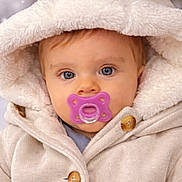 Aylonn participe au concours pour gagner de l'argent avec cette photo : baby, child, pacifier, hood, coat, button, blue_eyes, winter, blurred_background, soft_texture, cute, portrait, warm_clothing, infant, face, outdoor, cold_weather, cozy, fur_lining, closeup