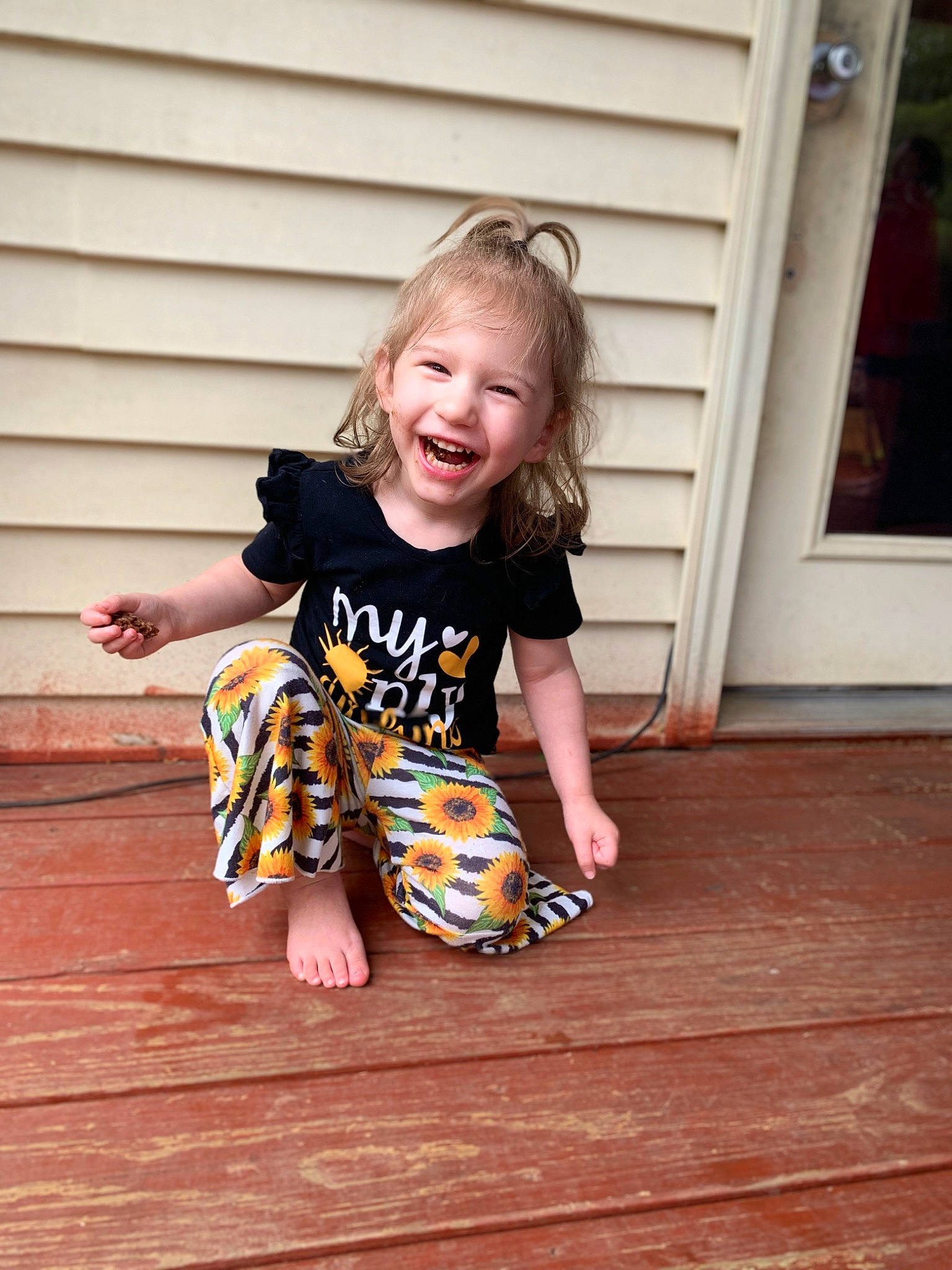 Aspyn joined the competition — help win amazing prizes! baby_toddler_clothing, barefoot, face, floor, flooring, foot, fun, hair, happy, hardwood, human_leg, joy, pattern, person, sleeve, smile, t_shirt, toddler, varnish, wood