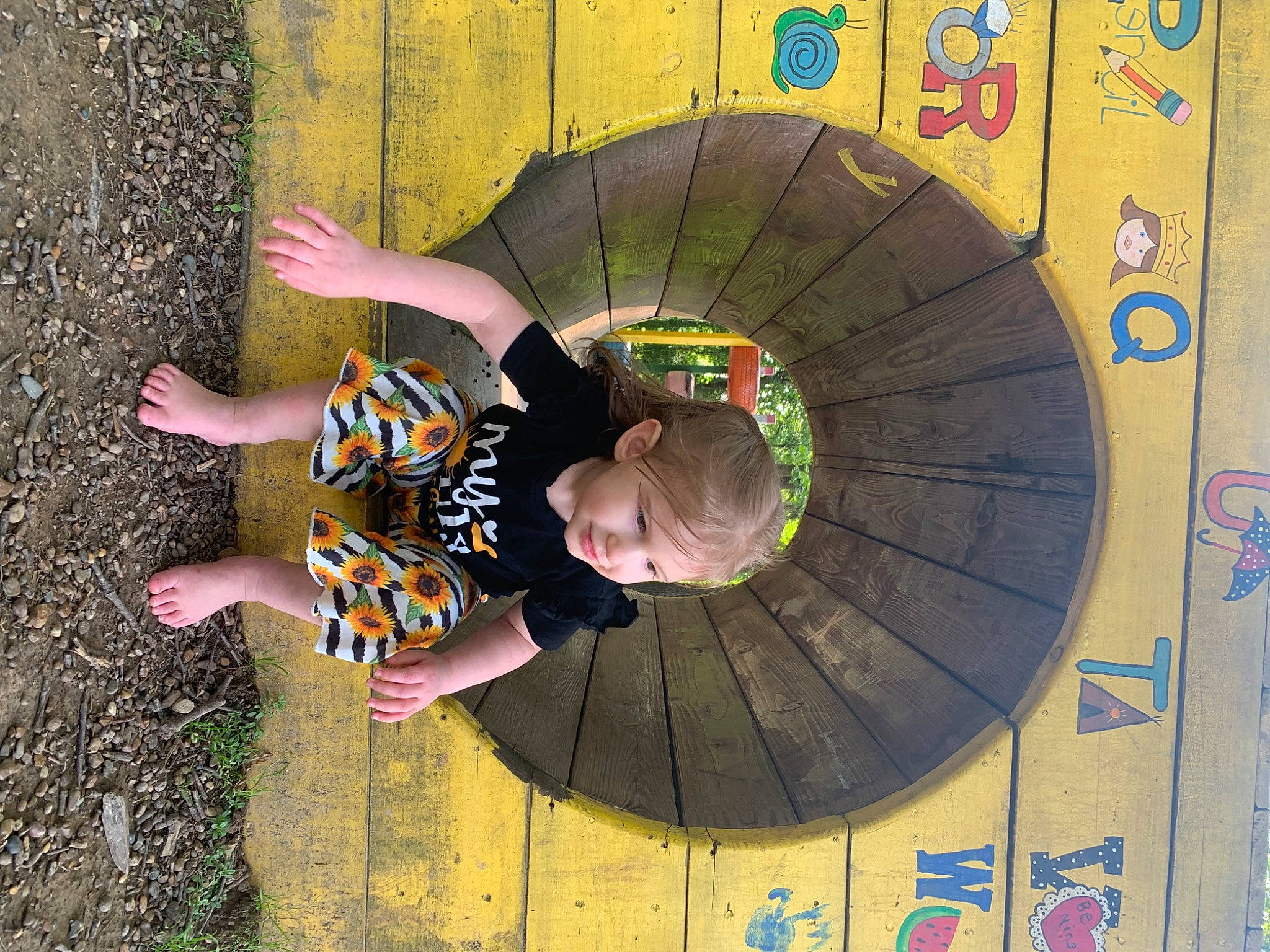 Aspyn joined the competition — help win amazing prizes! automotive_wheel_system, child, circle, concrete, flooring, fun, grass, happy, joy, leisure, person, photography, play, recreation, snapshot, t_shirt, toddler, visual_arts, wall, world