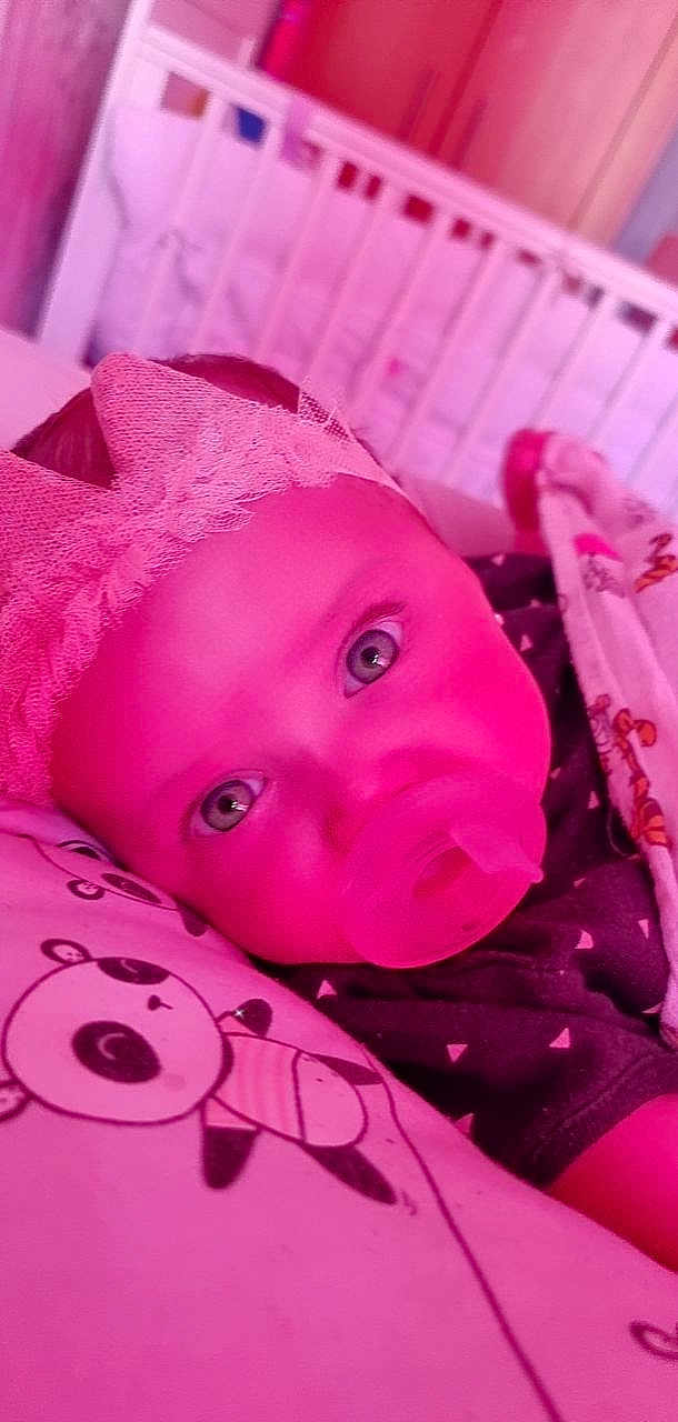 Pietra is registered to the contest to win money with this photo: baby, baby_toddler_clothing, cheek, eye, eyebrow, eyelash, happy, head, headgear, human_body, iris, lip, mouth, nose, pink, purple, skin, toddler, violet, white