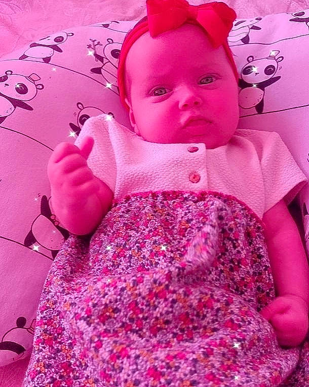 Pietra joined the competition — help win amazing prizes! baby, baby_toddler_clothing, day_dress, doll, dress, embellishment, face, lip, magenta, one_piece_garment, outerwear, person, pink, purple, red, skin, sleeve, textile, toddler, toy