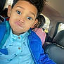 Zayden joined the competition — help win amazing prizes! backseat, beads, blue_jacket, boy, buttons, car, casual_clothing, child, curly_hair, daylight, expression, funny_face, indoor, person, portrait, seat, seatbelt, shirt, vehicle, window