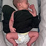 newborn, baby, sleeping, diaper, bassinet, infant, black_cloth, peaceful, cozy, cute, human, child, resting, indoors, skin, limbs, head, face, small_hands, feet