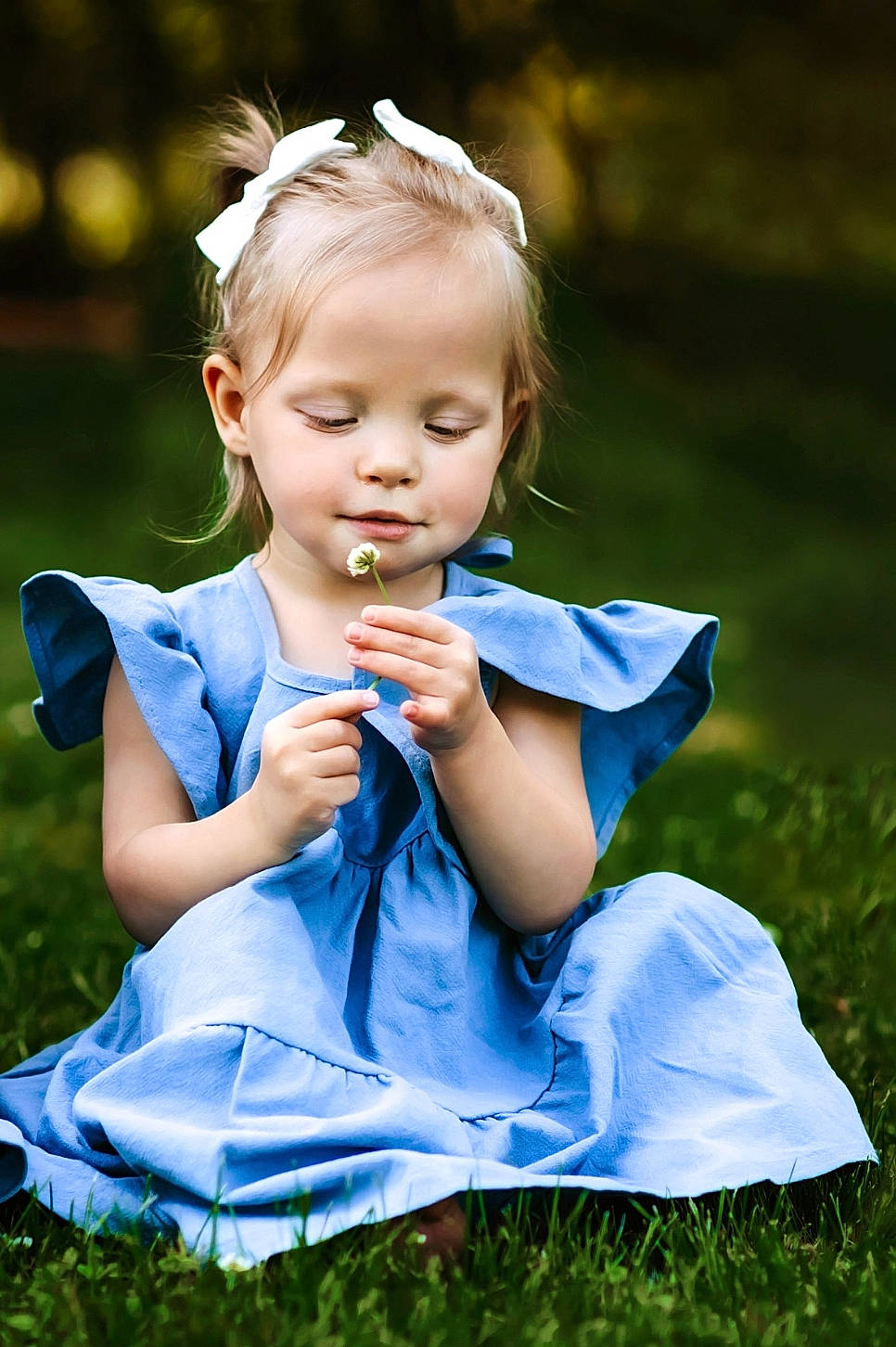 Miah is registered to the contest to win money with this photo: baby, baby_toddler_clothing, blond, child, dress, electric_blue, flash_photography, formal_wear, fun, grass, grassland, happy, iris, meadow, people_in_nature, person, plant, sitting, sunlight, toddler