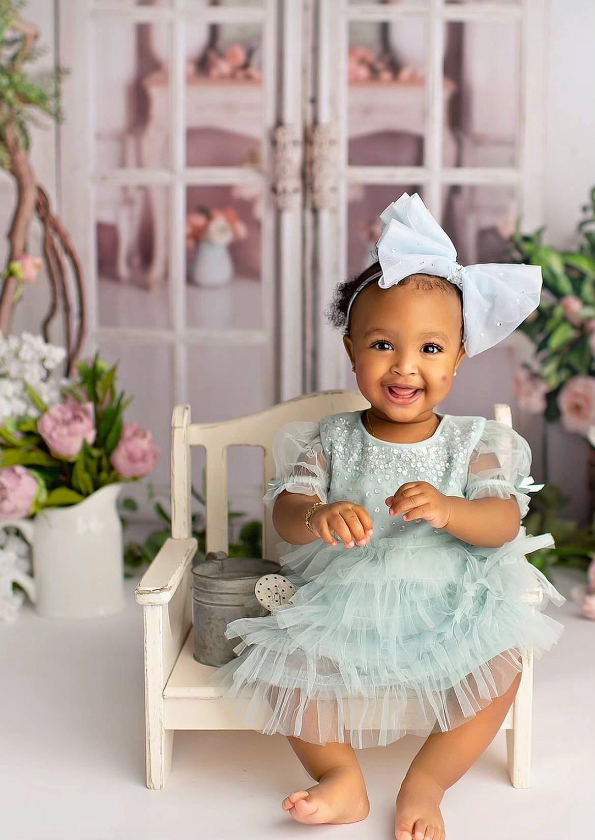 Kalani is registered to the contest to win money with this photo: baby, baby_toddler_clothing, child, day_dress, embellishment, event, fashion_accessory, hair_accessory, happy, hat, headpiece, joy, peach, person, pink, plant, sitting, sleeve, smile, table