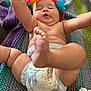 Jaxon is registered to the contest to win money with this photo: baby, infant, diaper, toy, headband, blanket, arm, leg, foot, skin, cute, playful, indoors, closeup, child, person, colorful, knitted, cream, tube