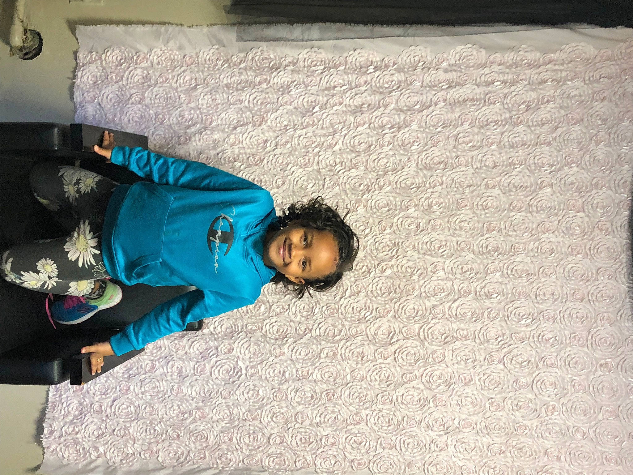 Jaliyah is registered to the contest to win money with this photo: bedding, child, comfort, electric_blue, flooring, fun, joy, leisure, linens, nap, person, room, sitting, toddler