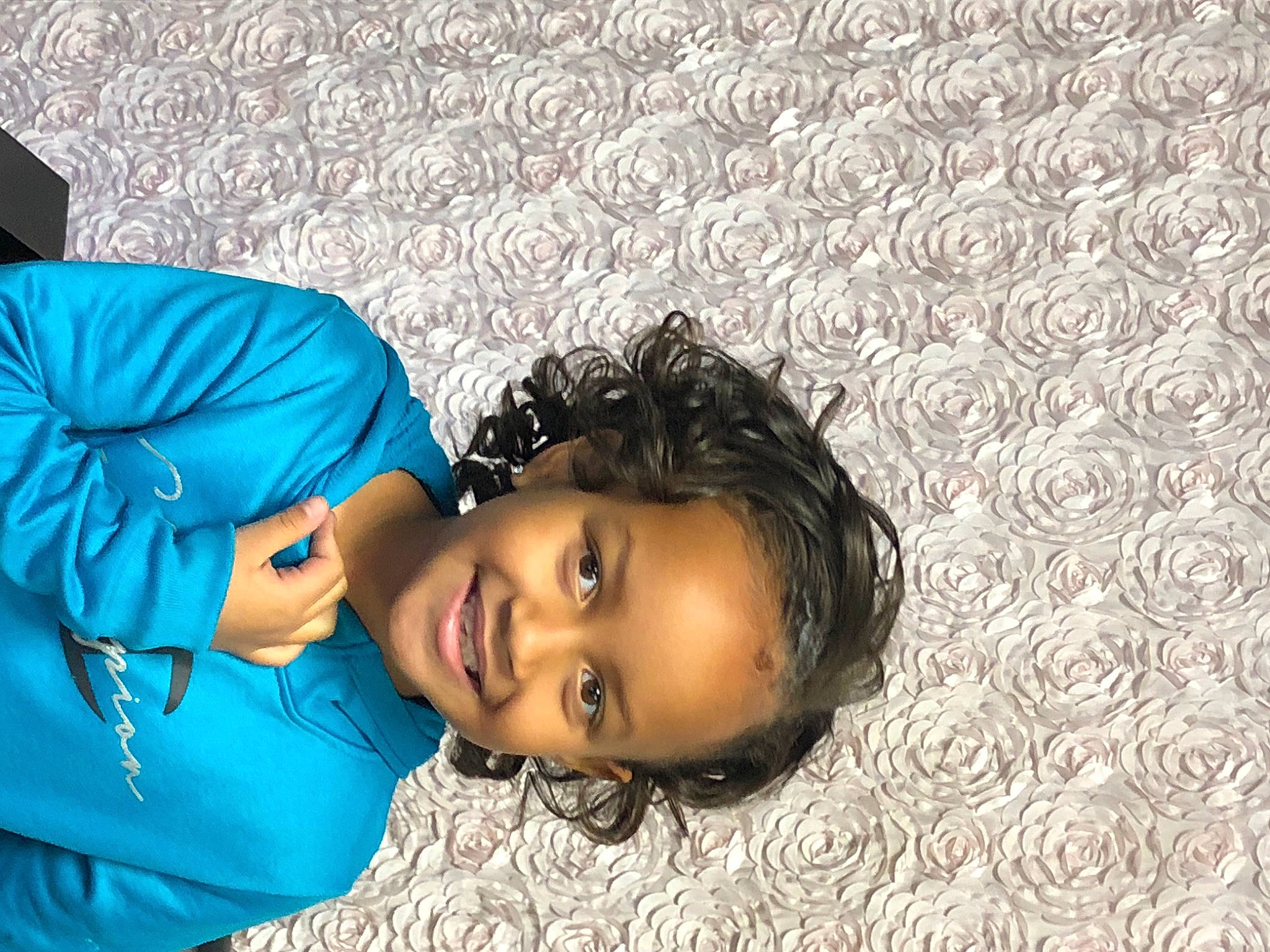 Jaliyah is registered to the contest to win money with this photo: black_hair, child, electric_blue, eye, eyewear, fashion_accessory, flash_photography, flooring, fun, happy, head, jewellery, joy, leisure, person, photo_shoot, portrait_photography, sitting, smile, toddler