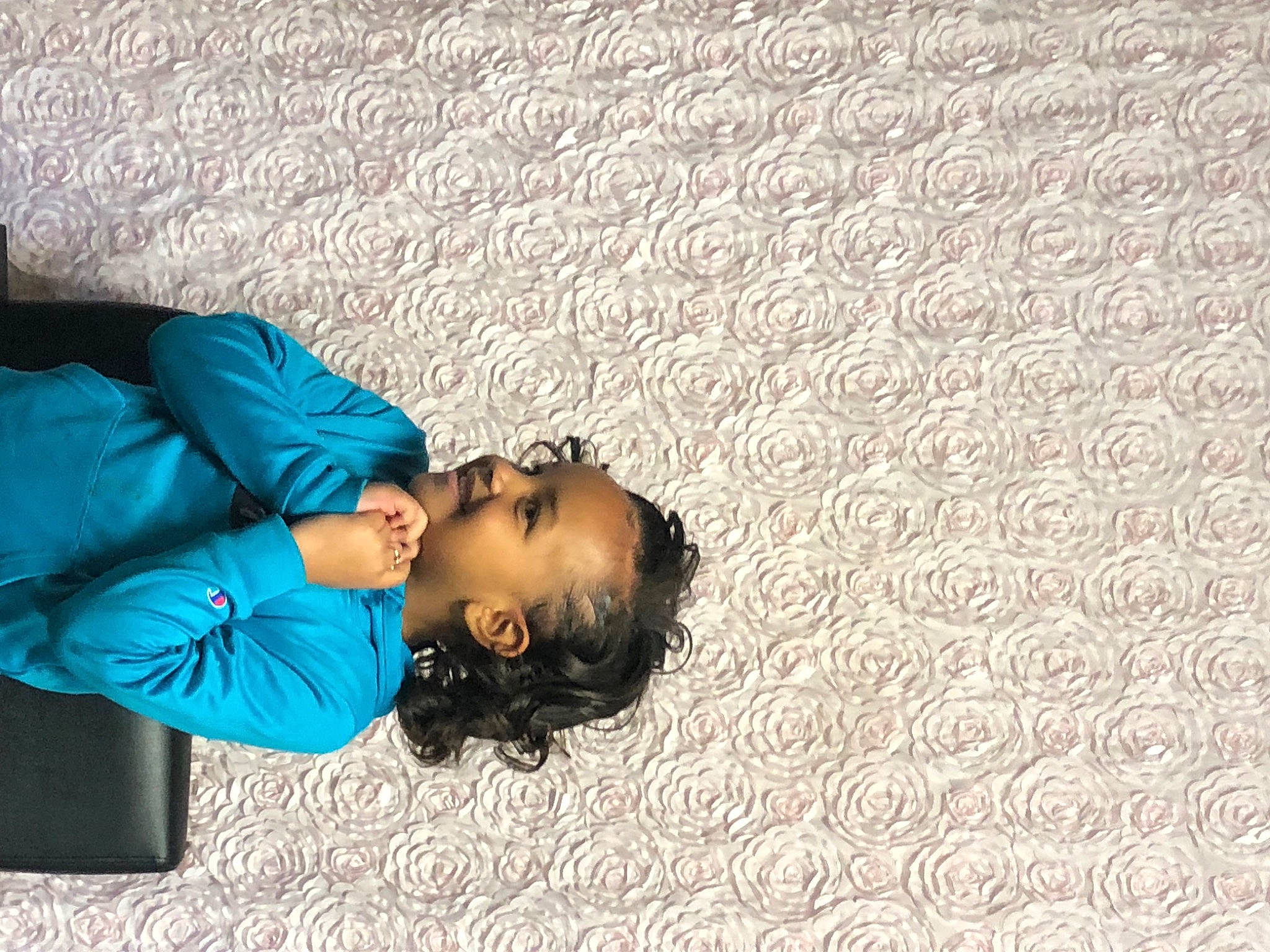 Jaliyah is registered to the contest to win money with this photo: child, comfort, electric_blue, fashion_accessory, flooring, fun, happy, joy, leisure, linens, nap, pattern, person, portrait_photography, sitting, sleep, textile, travel, wood