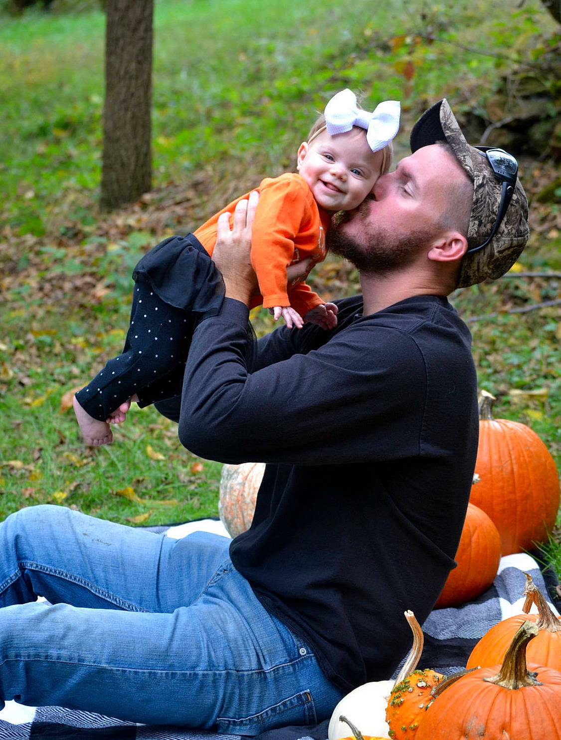 Laney joined the competition — help win amazing prizes! autumn, child, fun, grass, hug, interaction, joy, leaf, leisure, person, photography, plant, pumpkin, recreation, sitting, tree