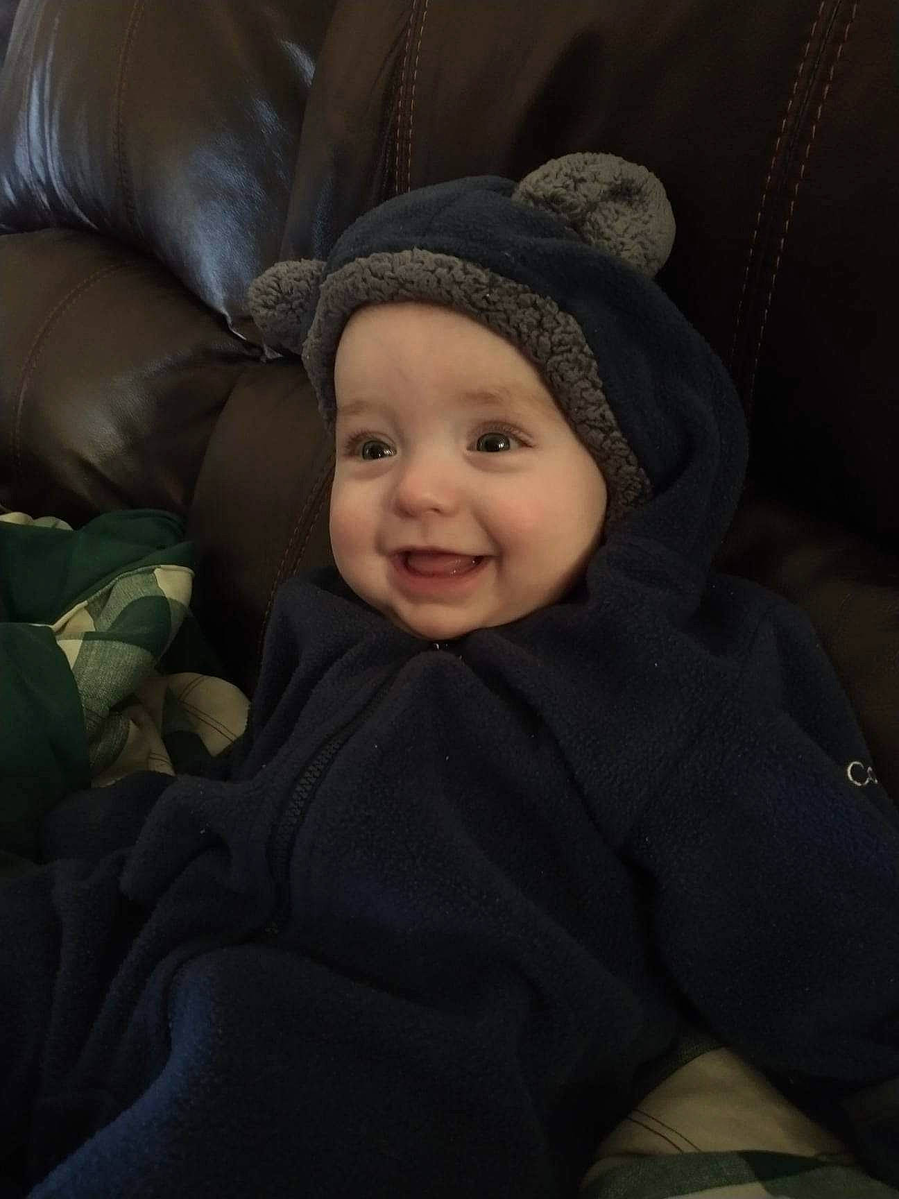 Anderson joined the competition — help win amazing prizes! baby, beanie, cap, car_seat, cheek, child, comfort, darkness, eye, flash_photography, grey, happy, headwear, joy, knit_cap, laugh, linens, person, portrait_photography, sitting