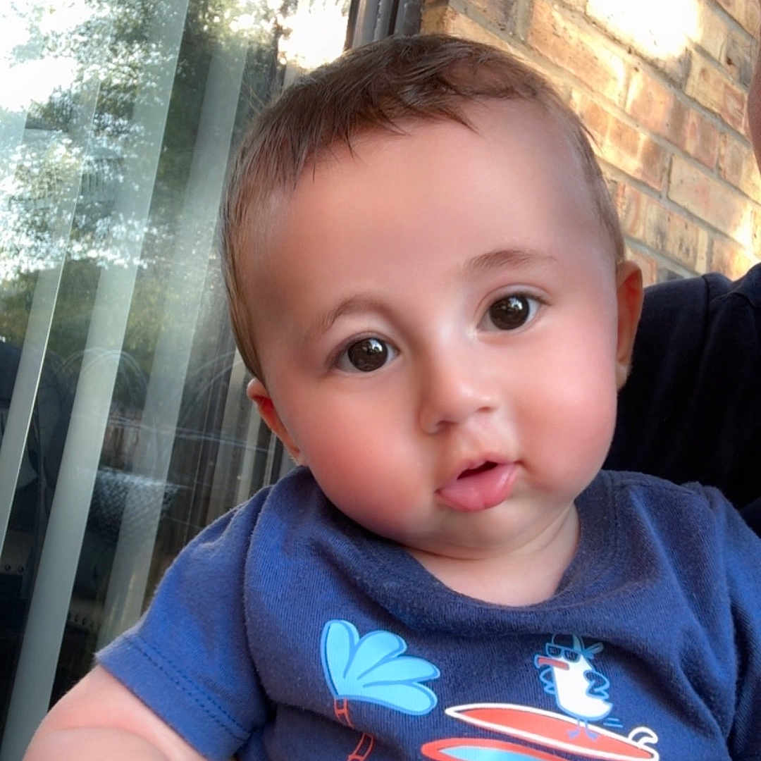 Leen joined the competition — help win amazing prizes! baby, bird, blue_shirt, brick_wall, car_design, casual_clothing, child, curious_look, cute, face, hand, indoors, person, portrait, reflection, short_hair, smiling, sunlight, window, young_child