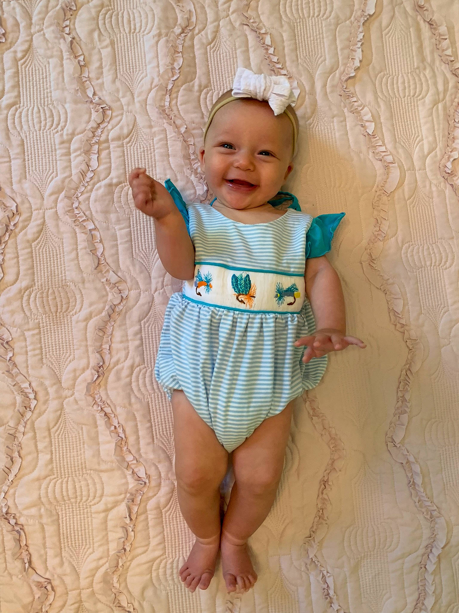 Bennett is registered to the contest to win money with this photo: arm, baby, baby_toddler_clothing, beauty, day_dress, eye, face, happy, head, joy, one_piece_garment, pattern, person, pink, plant, skin, sleeve, smile, t_shirt, textile