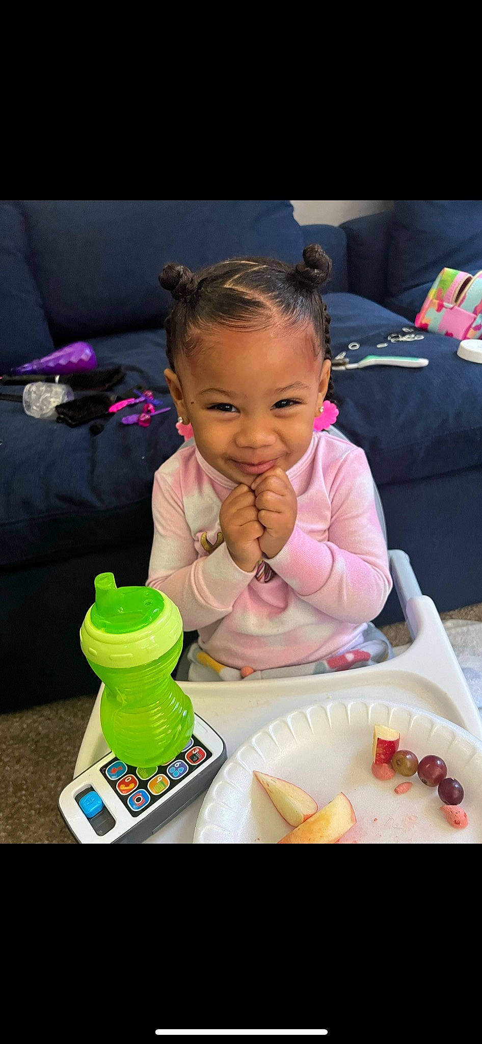 Elli is registered to the contest to win money with this photo: baby, baby_playing_with_toys, baby_toddler_clothing, chair, child, drinkware, event, food, food_craving, fun, joy, person, pink, plastic_bottle, plate, product, room, skin, smile, table