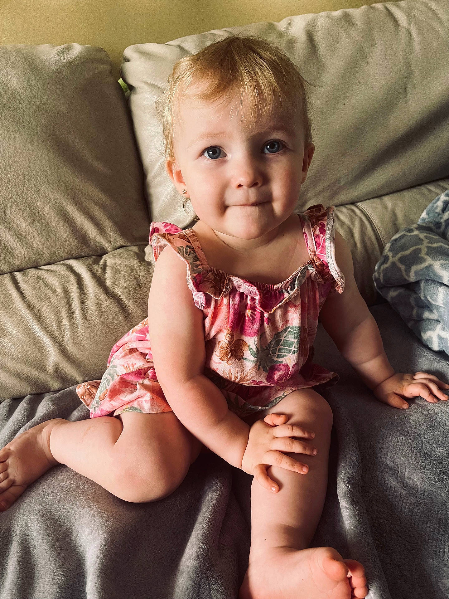 Ariya is registered to the contest to win money with this photo: baby, bed, blonde, bodypart, couch, cushion, face, finger, furniture, hair, hand, happy, head, homedecor, indoors, person, photography, portrait, sitting, smile