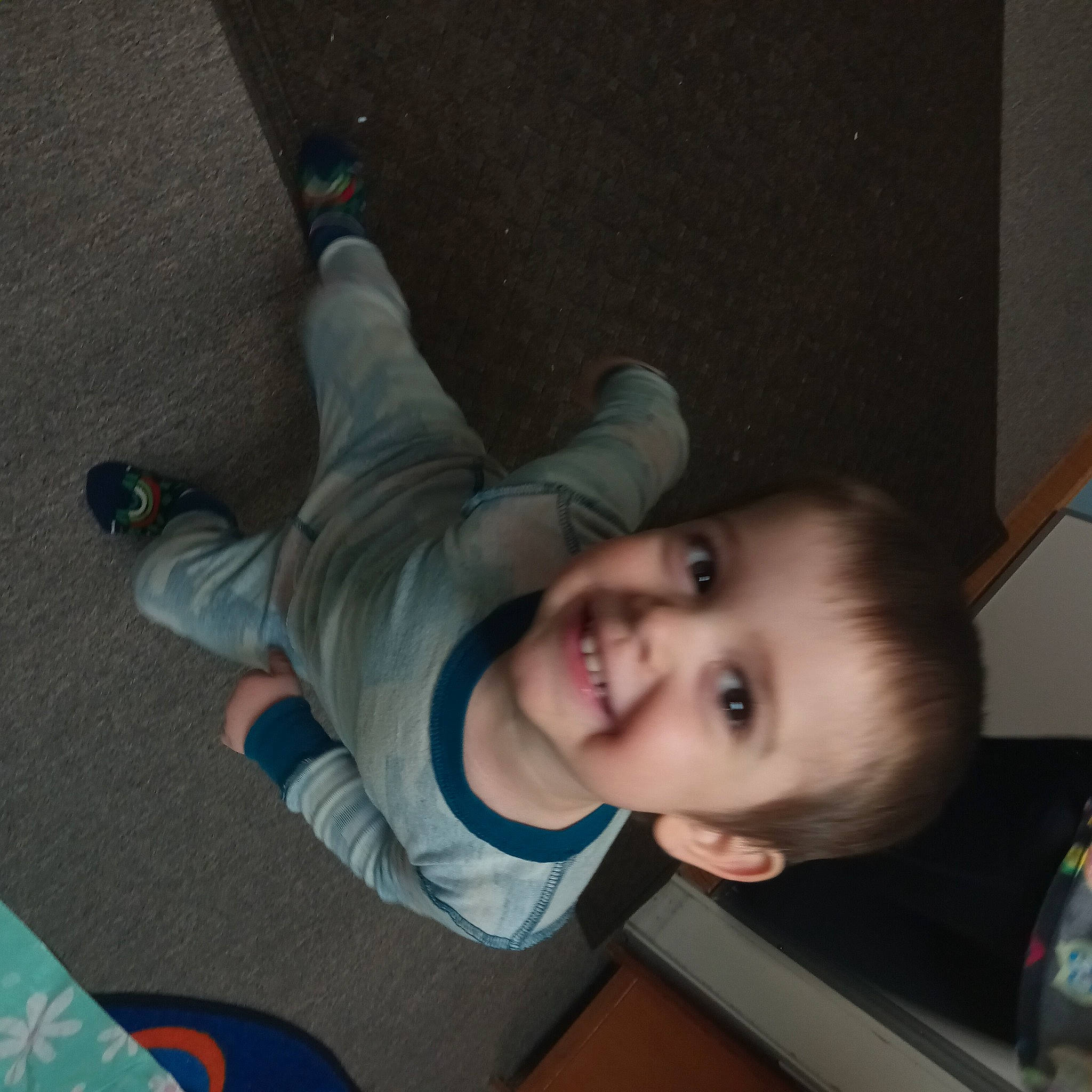 Ashton is registered to the contest to win money with this photo: baby, baby_products, baby_toddler_clothing, cheek, child, comfort, cool, elbow, floor, flooring, fun, happy, human_leg, joy, mouth, nose, person, sitting, smile, thumb