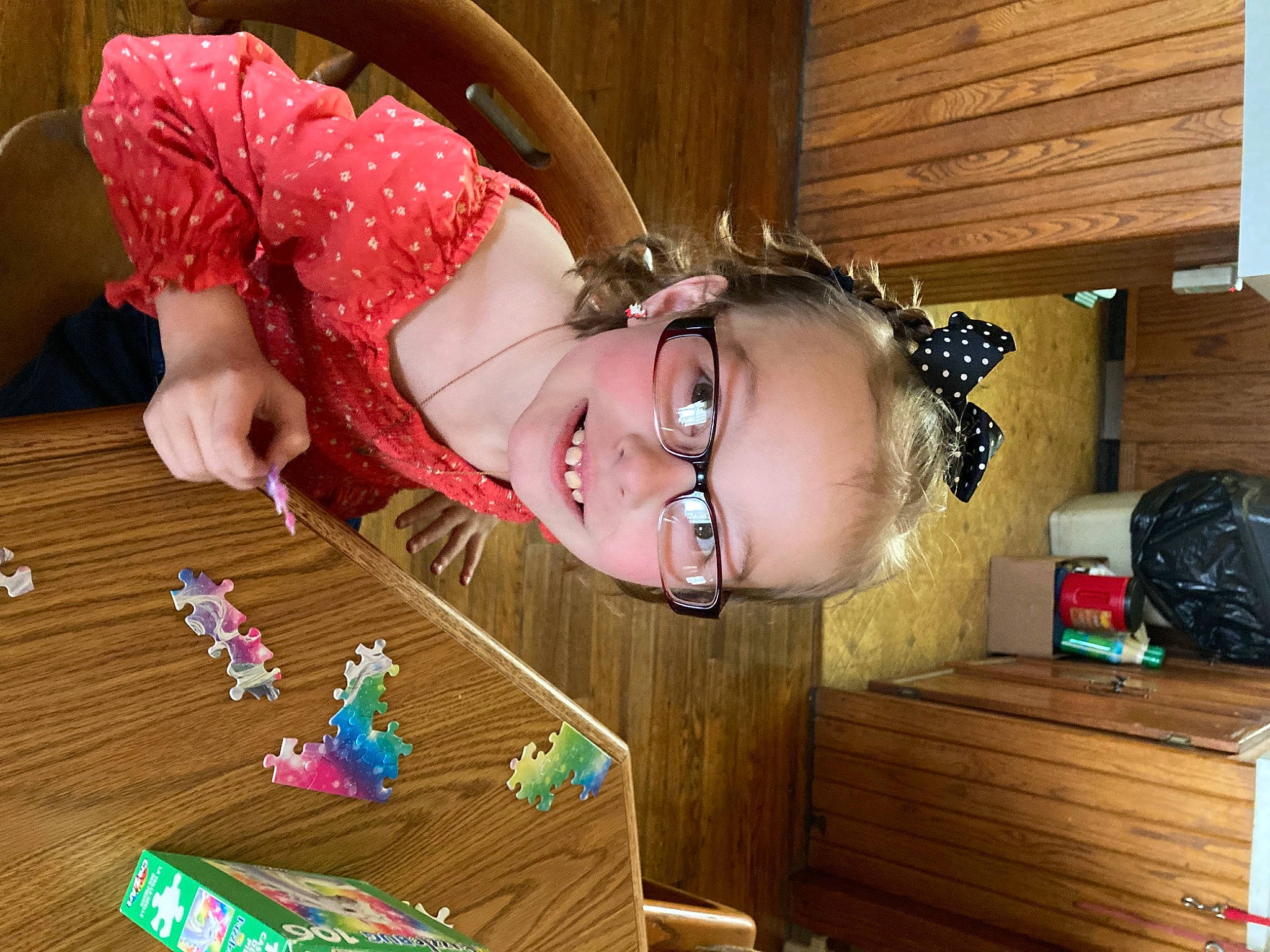 Marleigh is registered to the contest to win money with this photo: child, eyewear, flooring, fun, glasses, grass, happy, hardwood, holiday, indoor_games_and_sports, jewellery, joy, pattern, person, smile, sweetness, table, toddler, toy, varnish
