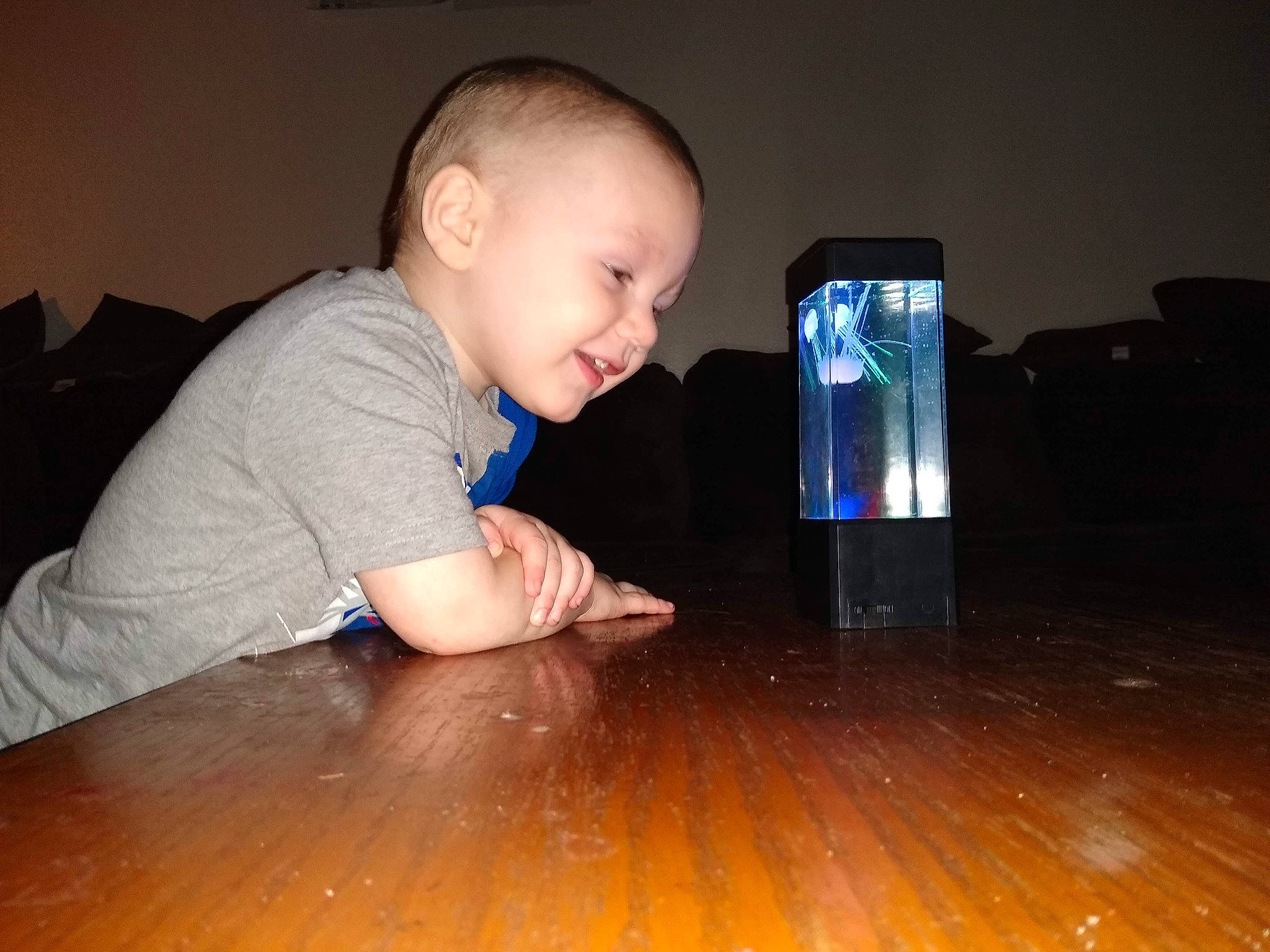 Jeremy is registered to the contest to win money with this photo: baby, child, floor, flooring, fun, hardwood, person, play, toddler, vacation, water, wood
