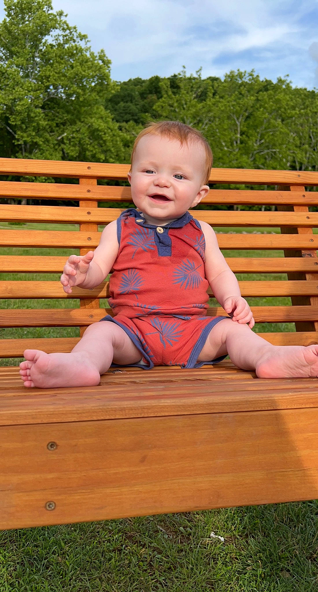 Rowen joined the competition — help win amazing prizes! baby, baby_toddler_clothing, child, eye, flooring, fun, grass, happy, hardwood, leisure, person, recreation, shorts, sitting, sky, smile, t_shirt, toddler, tree, wood