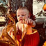 Ivar is registered to the contest to win money with this photo: autumn, baby, child, corn_husks, curious, cute, decoration, fall, garden, harvest, holiday, nature, orange, outdoor, person, pumpkin, seasonal, skin, sunlight, tree