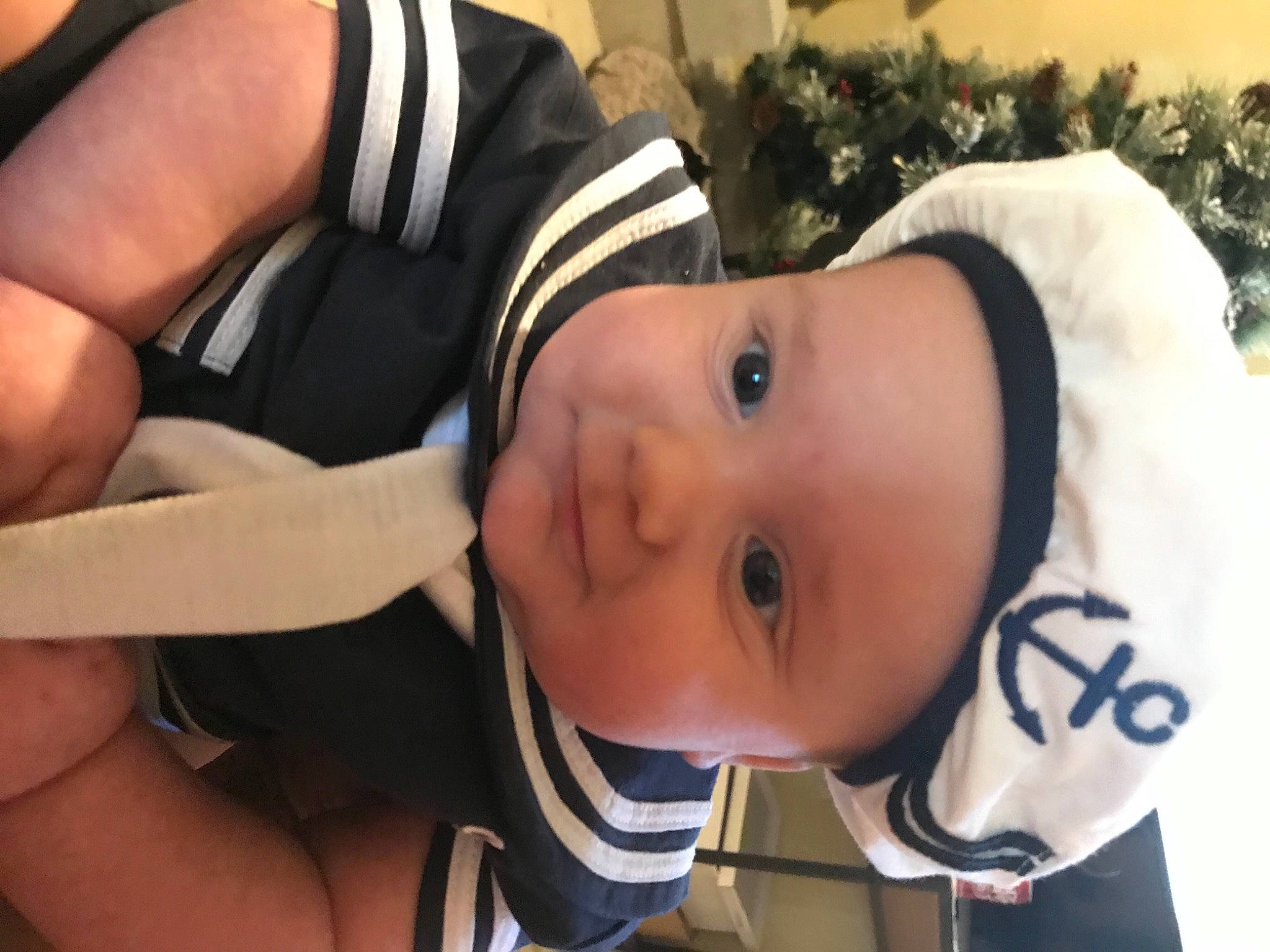 Sawyer joined the competition — help win amazing prizes! baby, baby_toddler_clothing, cheek, child, event, eye, face, fun, gesture, happy, head, headgear, headwear, helmet, person, personal_protective_equipment, plant, sitting, skin, thumb
