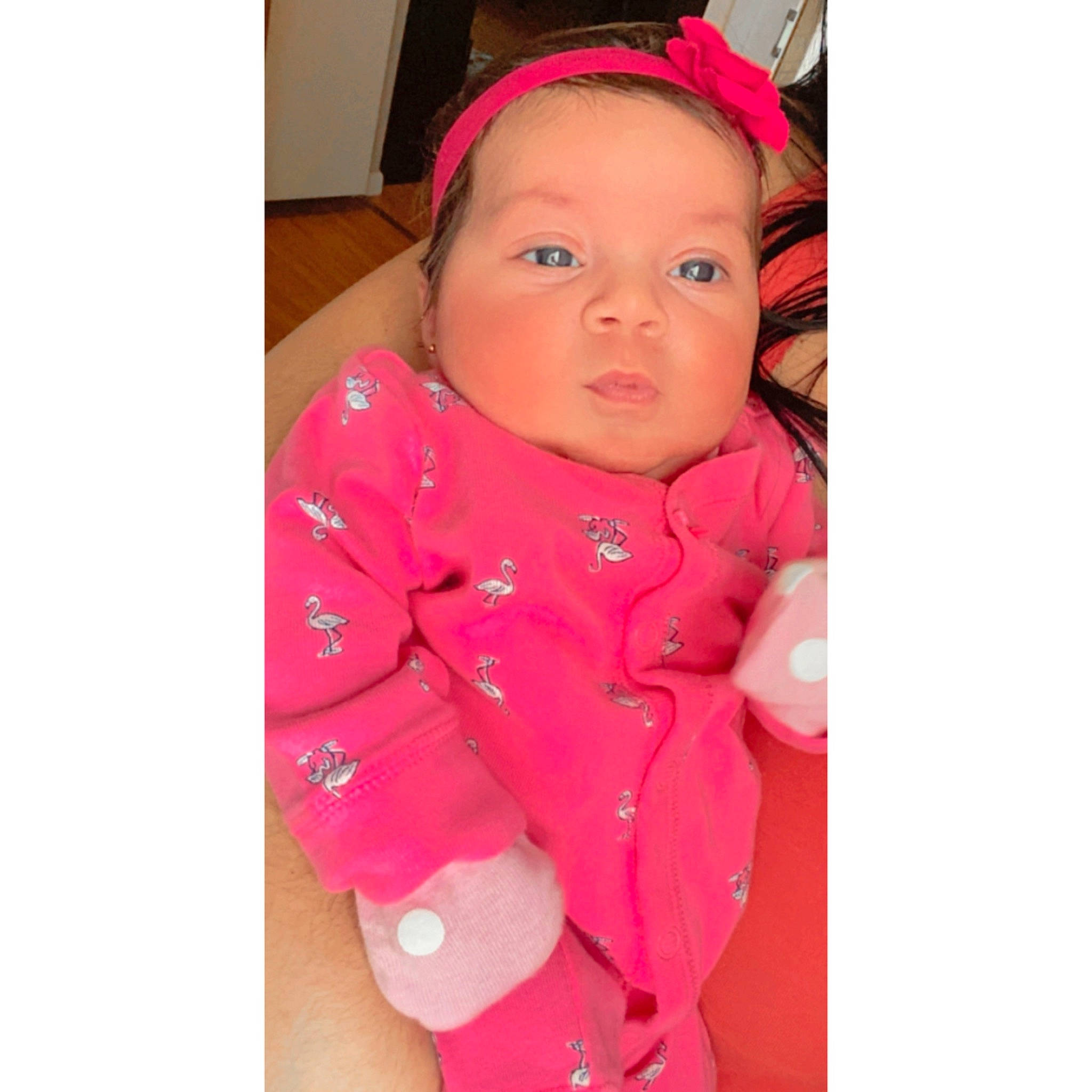 Melanie is registered to the contest to win money with this photo: arm, baby, baby_toddler_clothing, clothing, collar, cool, dress, eyebrow, face, finger, hand, happy, head, headgear, headwear, jacket, neck, person, pink, skin