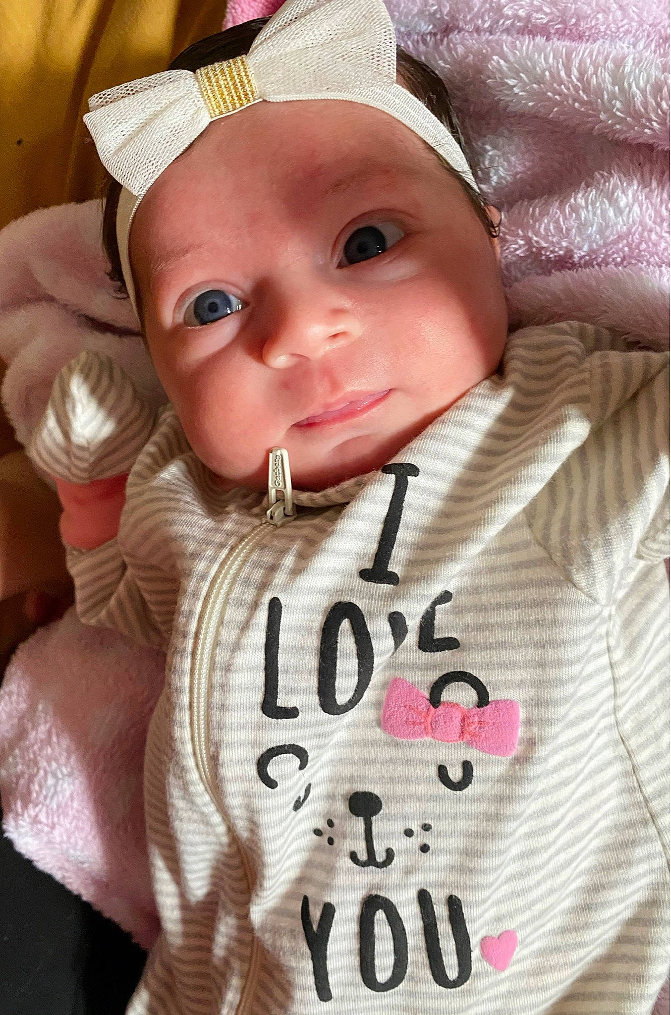 Melanie is registered to the contest to win money with this photo: baby, baby_toddler_clothing, cap, cheek, chin, cool, eye, eyebrow, face, finger, gesture, happy, head, lip, nose, person, pink, skin, sleeve, smile