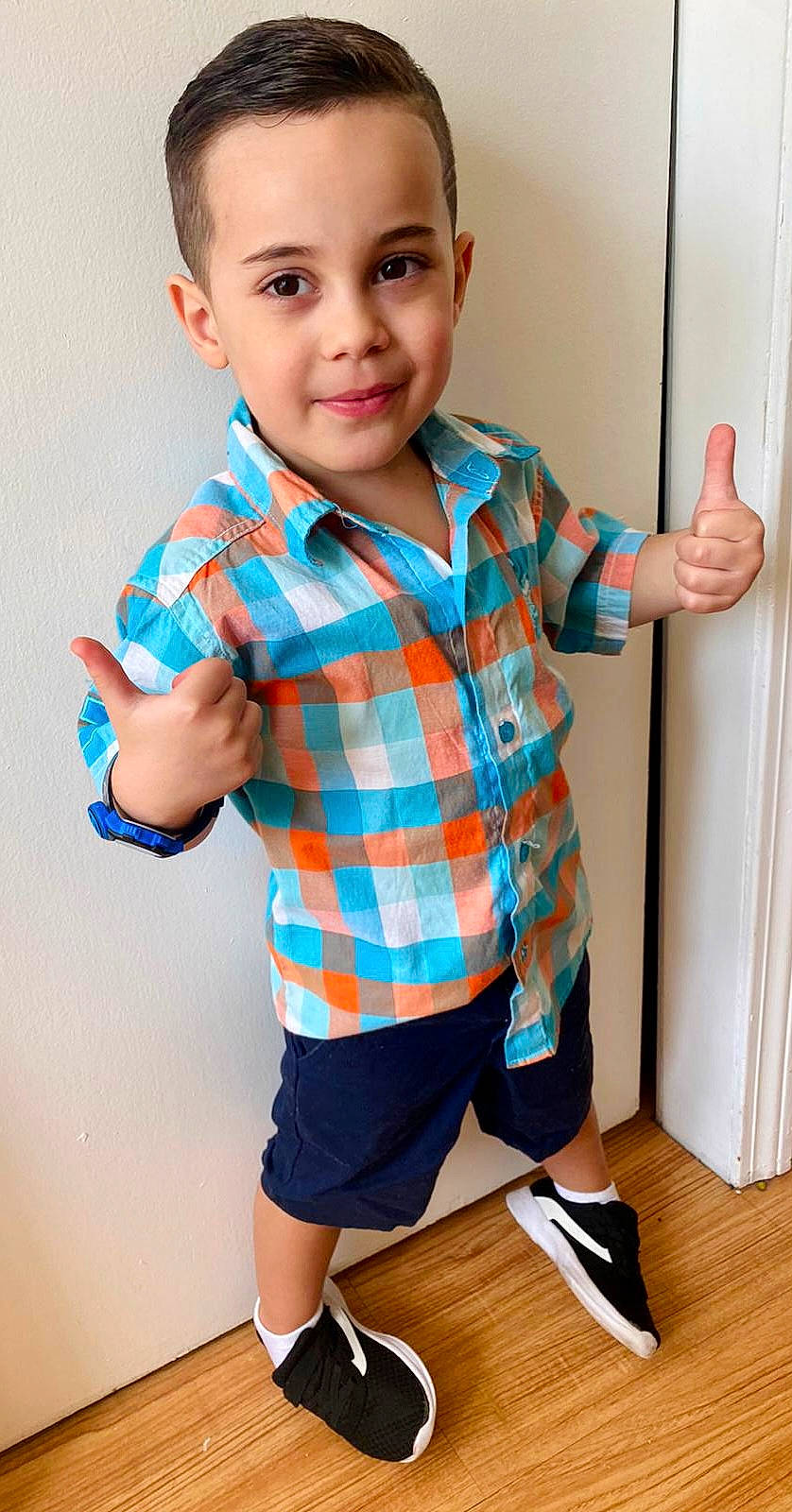 Bernardo joined the competition — help win amazing prizes! arm, baby_toddler_clothing, blue, chin, facial_expression, finger, gesture, hairstyle, hand, happy, joint, joy, muscle, neck, person, shoulder, sleeve, smile, standing, tartan