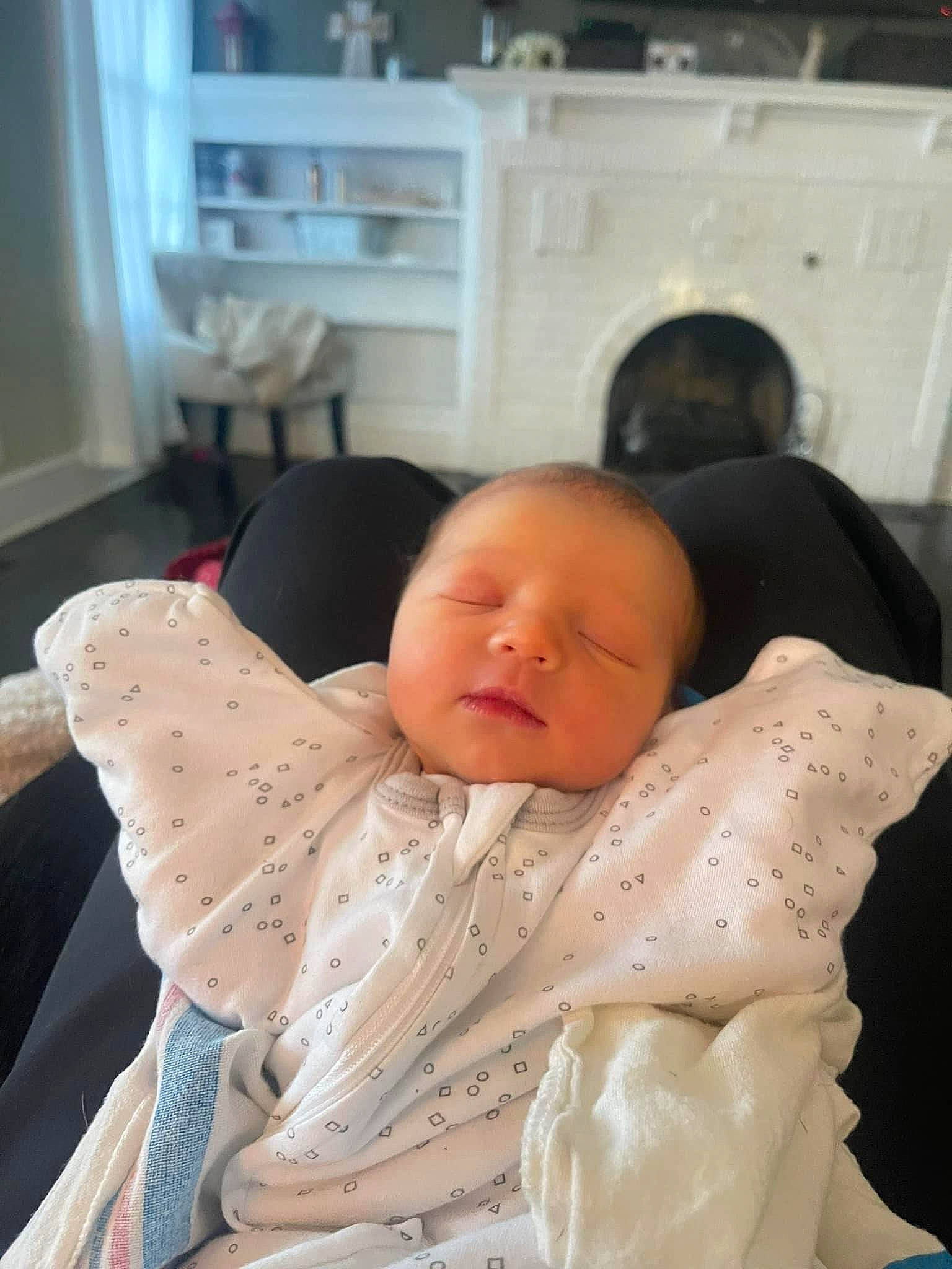 Alistair is registered to the contest to win money with this photo: baby, baby_products, baby_sleeping, baby_toddler_clothing, cheek, child, comfort, linens, mouth, person, room, shelf, sitting, skin, sleep, sleeve, toddler