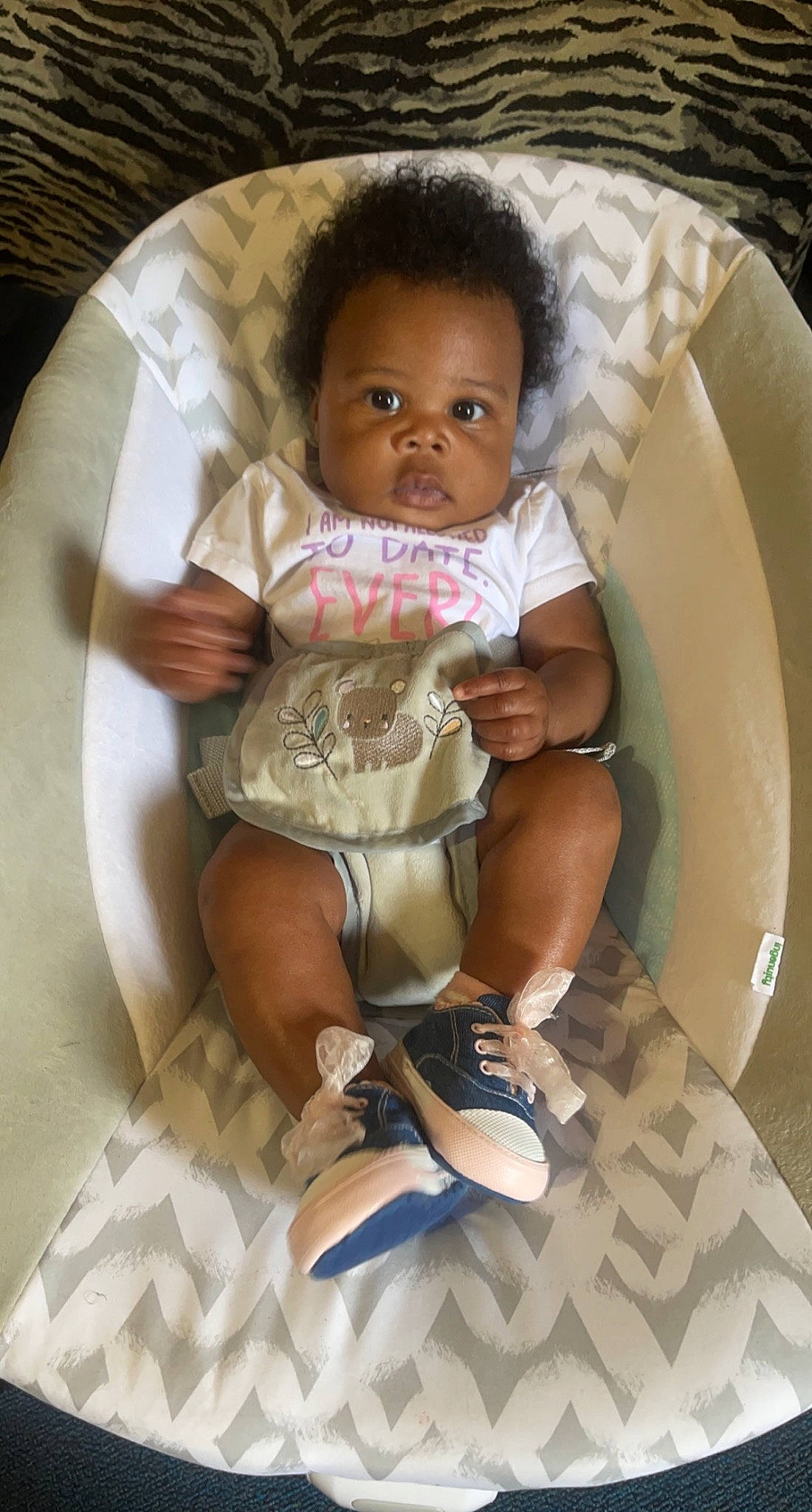Hazel is registered to the contest to win money with this photo: baby, baby_products, baby_toddler_clothing, chair, chest, comfort, face, foot, fun, human_leg, knee, lap, leg, nail, person, sandal, sitting, skin, sock, thigh