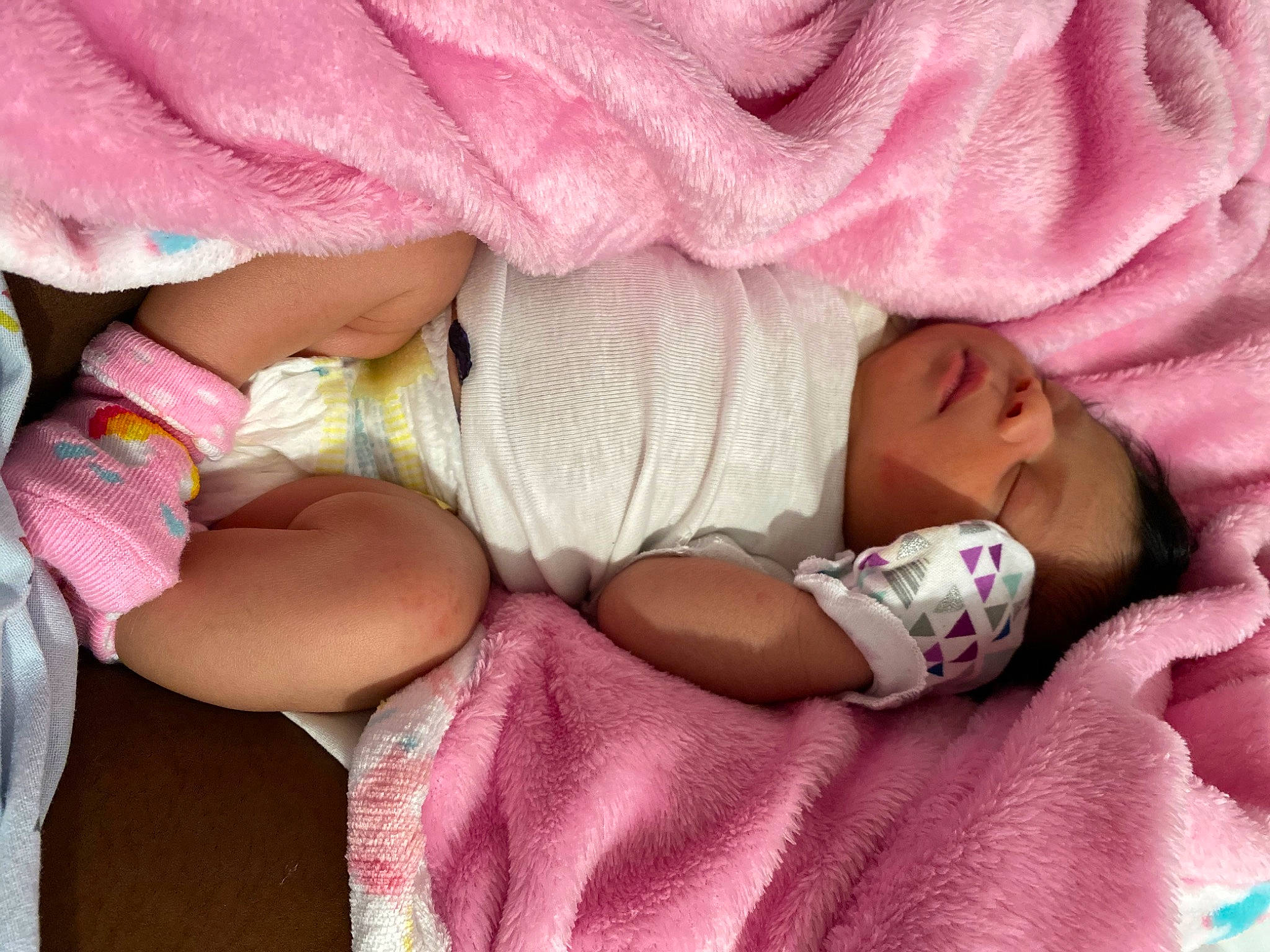 Annaliese joined the competition — help win amazing prizes! baby, baby_products, baby_sleeping, baby_toddler_clothing, bedtime, cheek, child, comfort, finger, hand, happy, headgear, knit_cap, linens, magenta, person, pink, product, purple, skin
