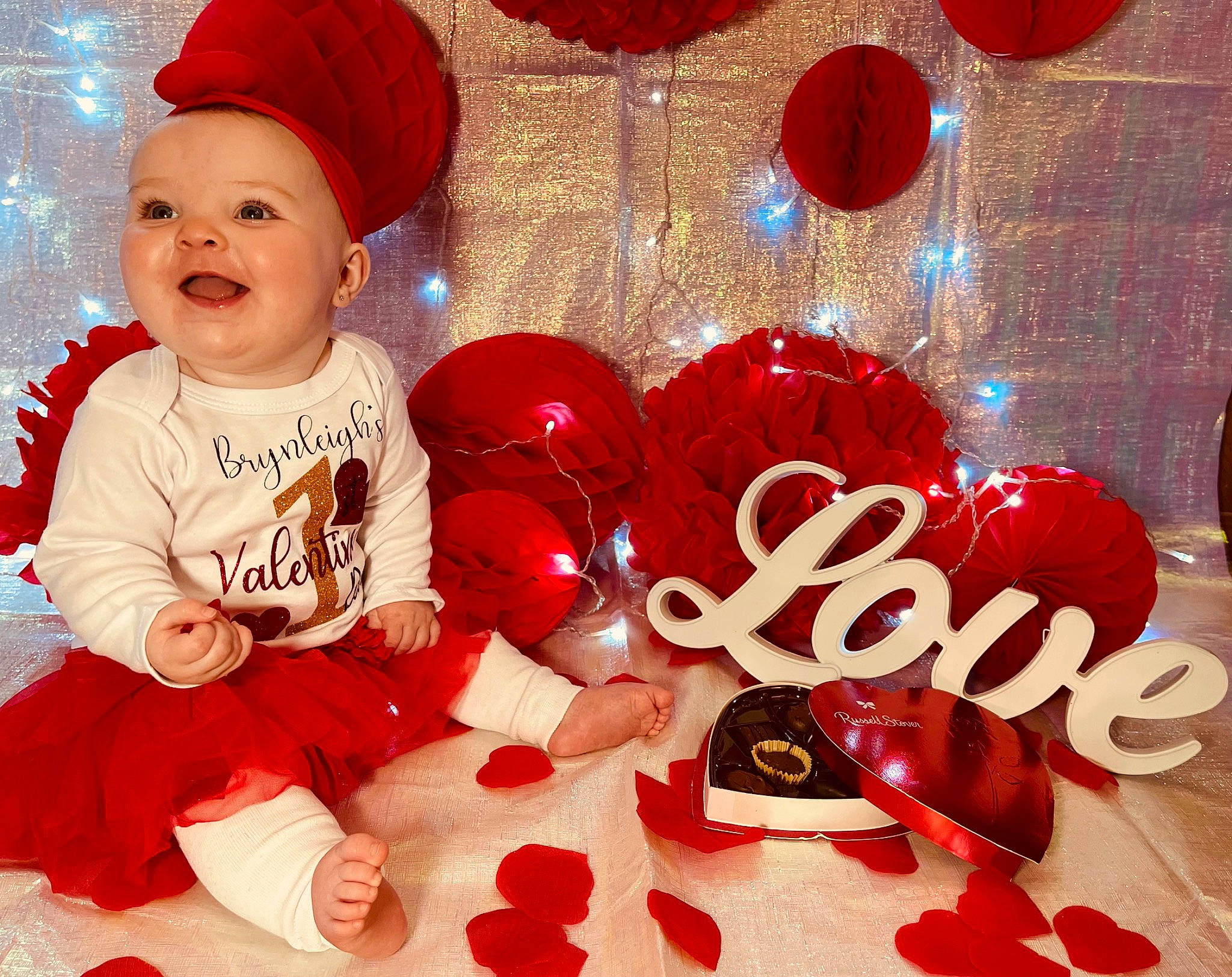 Brynleigh joined the competition — help win amazing prizes! baby, baby_toddler_clothing, carmine, christmas, christmas_decoration, christmas_eve, christmas_ornament, event, font, fun, happy, holiday, holiday_ornament, human_body, ornament, party_supply, person, red, sleeve, smile