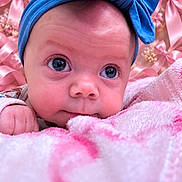 Brynlee Jade Walker joined the competition — help win amazing prizes! baby, infant, child, portrait, face, blue_bow, headband, pink_blanket, pink_background, wide_eyes, looking_at_camera, lying_down, cozy, soft_texture, nursery, indoor, close_up, adorable, fashion_accessory, photography