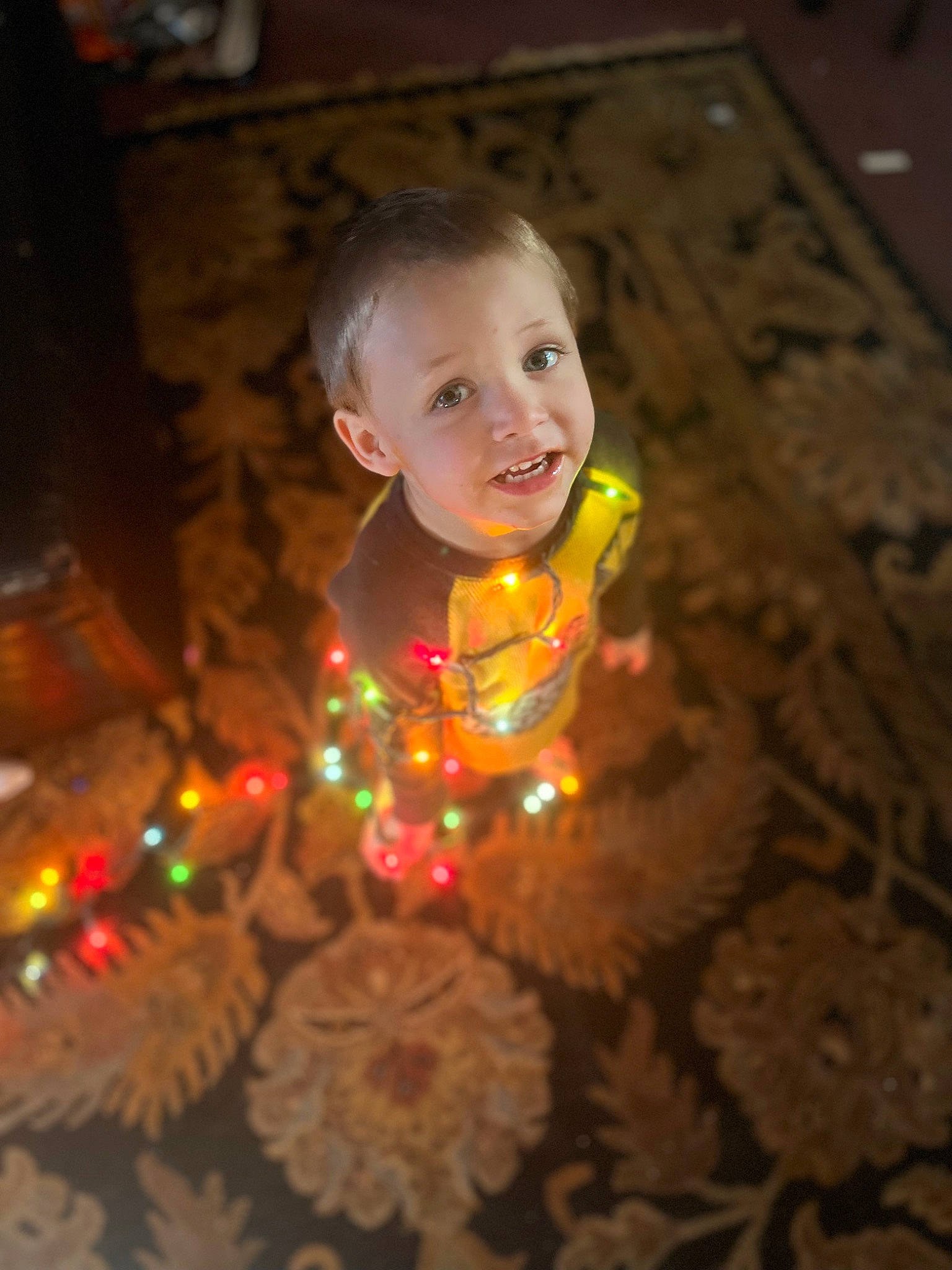 Phoenix joined the competition — help win amazing prizes! baby, candle, cheek, child, christmas, christmas_eve, christmas_ornament, darkness, event, eye, face, flooring, fun, happy, heat, holiday, person, smile, sweetness, toddler