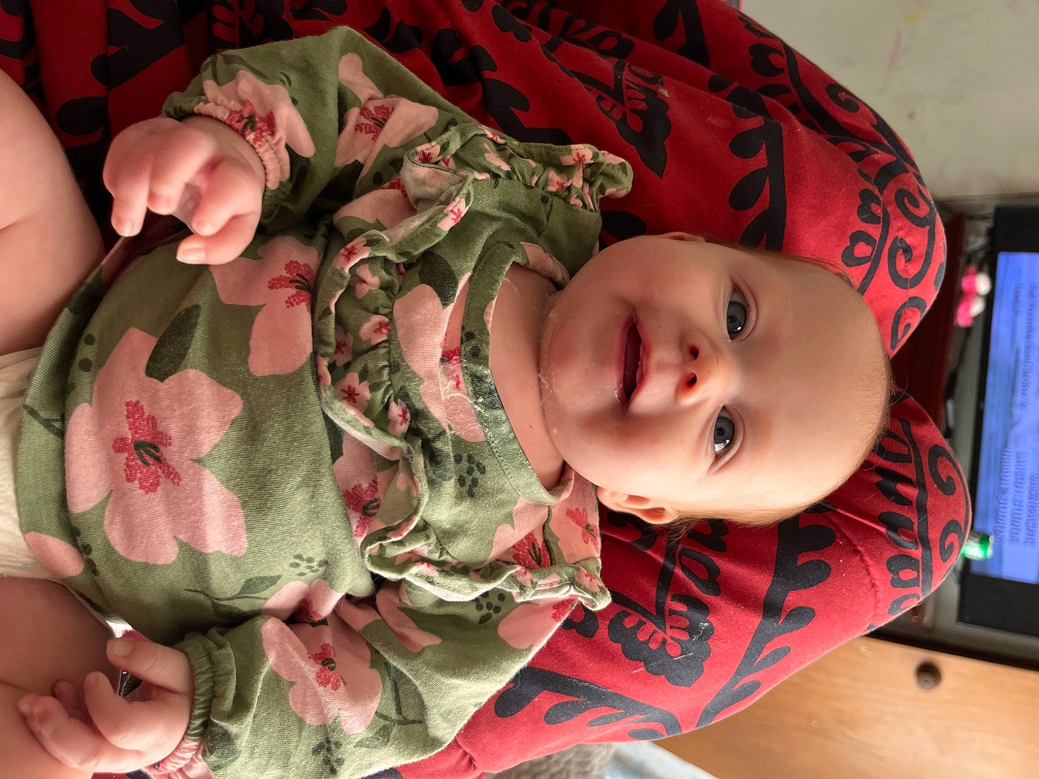 Emberlynn is registered to the contest to win money with this photo: baby, cheek, child, chin, eye, eyelash, facial_expression, gesture, hand, head, military_camouflage, mouth, neck, pattern, person, pink, rose, skin, sleeve, textile