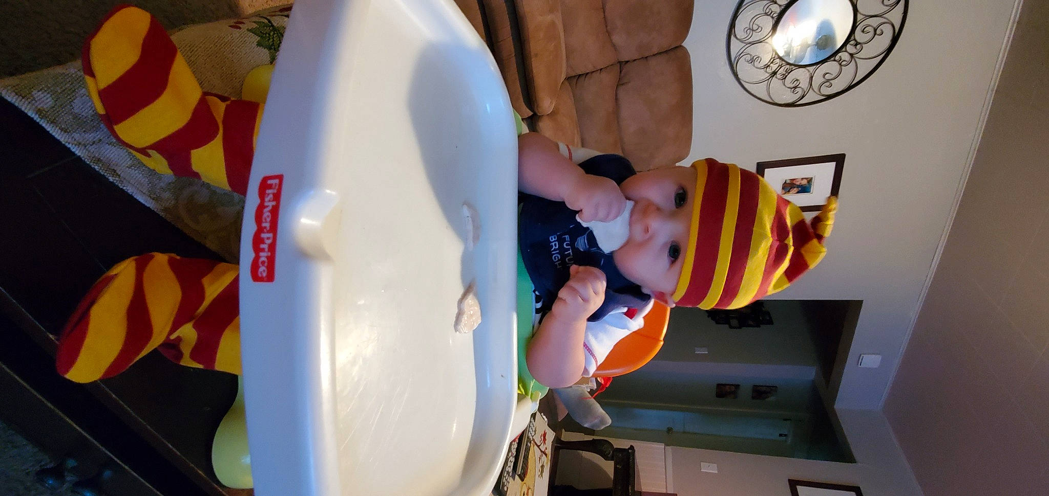 Kelton is registered to the contest to win money with this photo: automotive_wheel_system, baby, child, clock, design, fun, hat, headwear, machine, person, photography, playground_slide, recreation, room, t_shirt, toddler