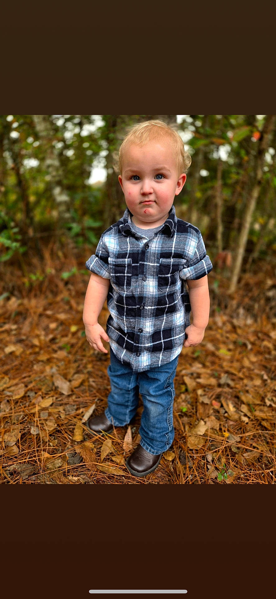 Silas is registered to the contest to win money with this photo: boy, child, clothing, face, footwear, happy, head, jeans, male, pants, person, photography, portrait, shirt, shoe, shorts, sitting, smile, soil, standing